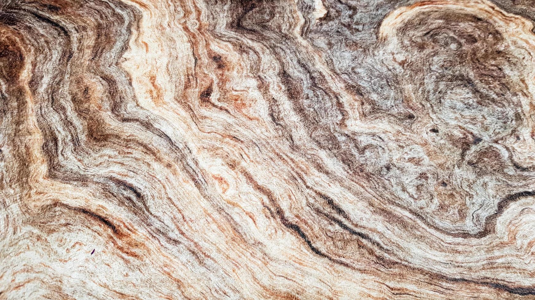 The surface of Sandstone with wavy brown veins. Sulphide agate texture. Wide image of brown natural stone texture Sphalerite. Beautiful wavy pattern of cut of Schalenblende stone close-up photo