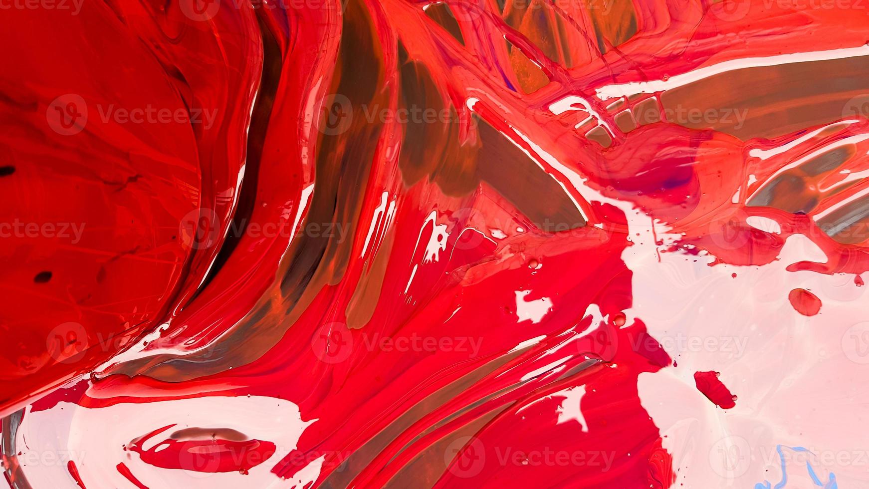 Abstract background of spilled red paint with buckets on a black backdrop. Red paint is pouring on a black background. Use it for an artist or creative concept. paints spilled red colored background photo