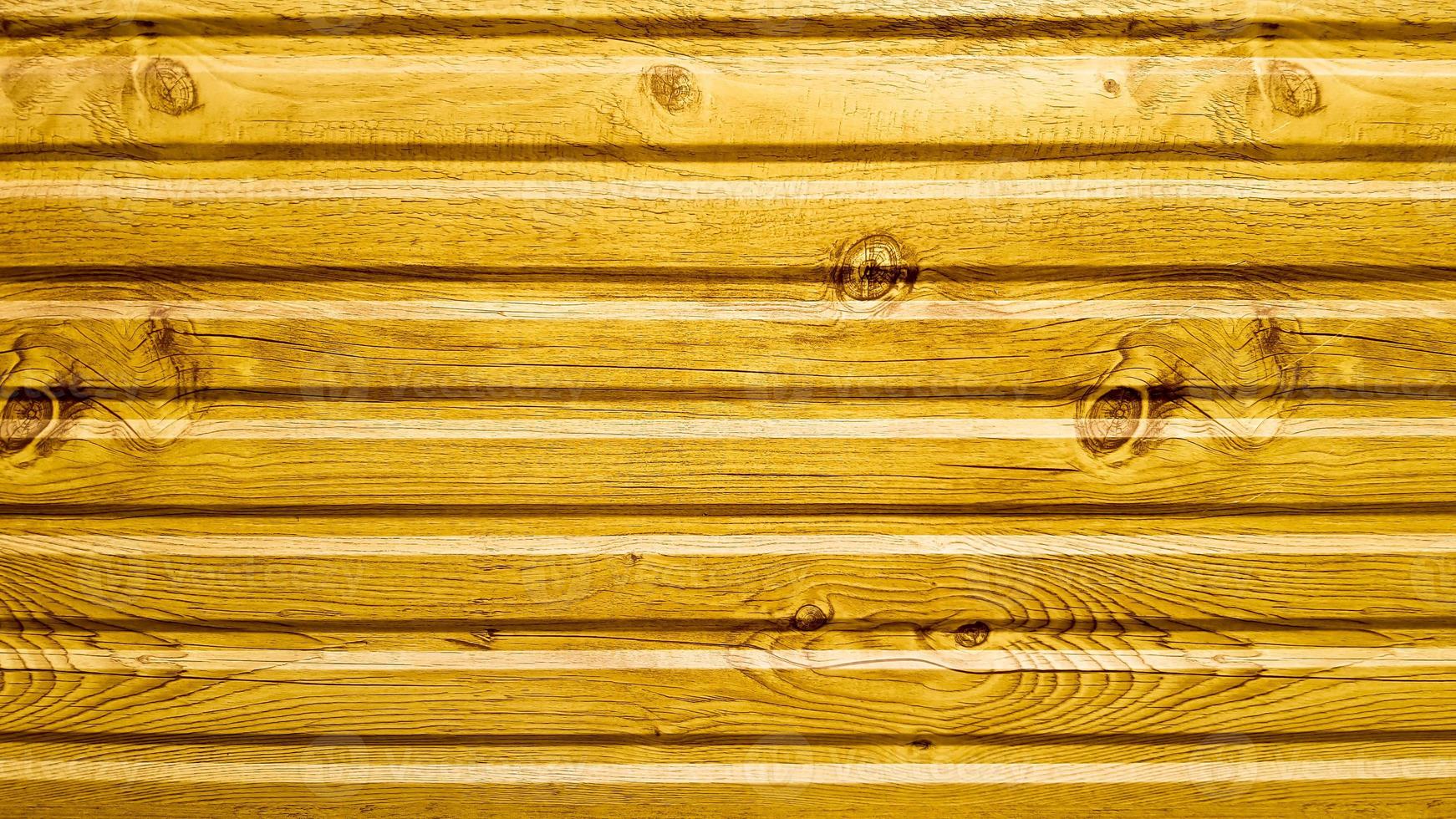 Light yellow painted wood texture, seamless textured pattern. The wall of bright yellow horizontal boards is laid horizontally. photo