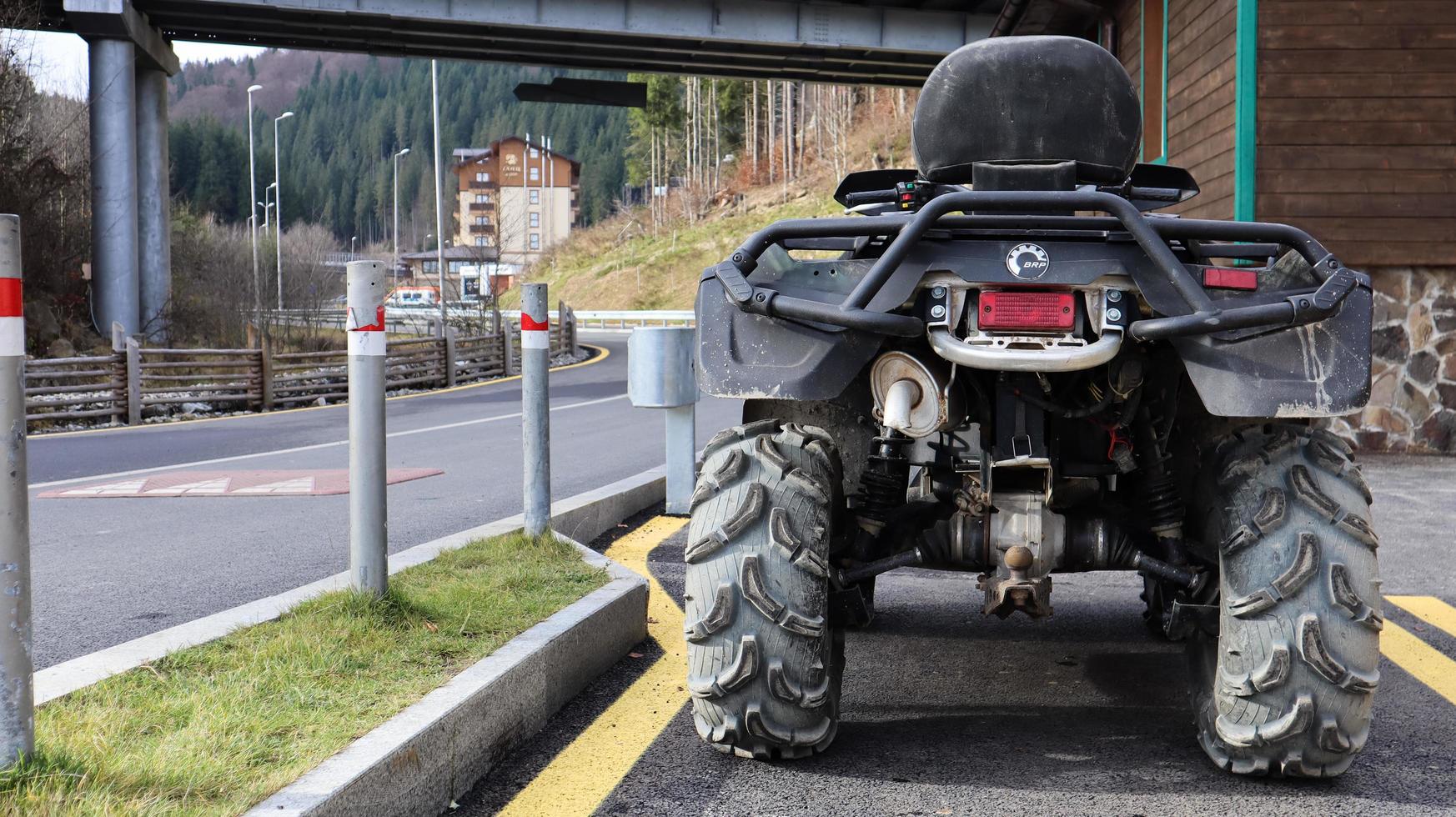 Ukraine, Bukovel - November 20, 2019. photo of a camouflage green SUV. A series of photos from different angles. four-wheel all-terrain vehicle, bicycle. Mountain excursions for tourists.