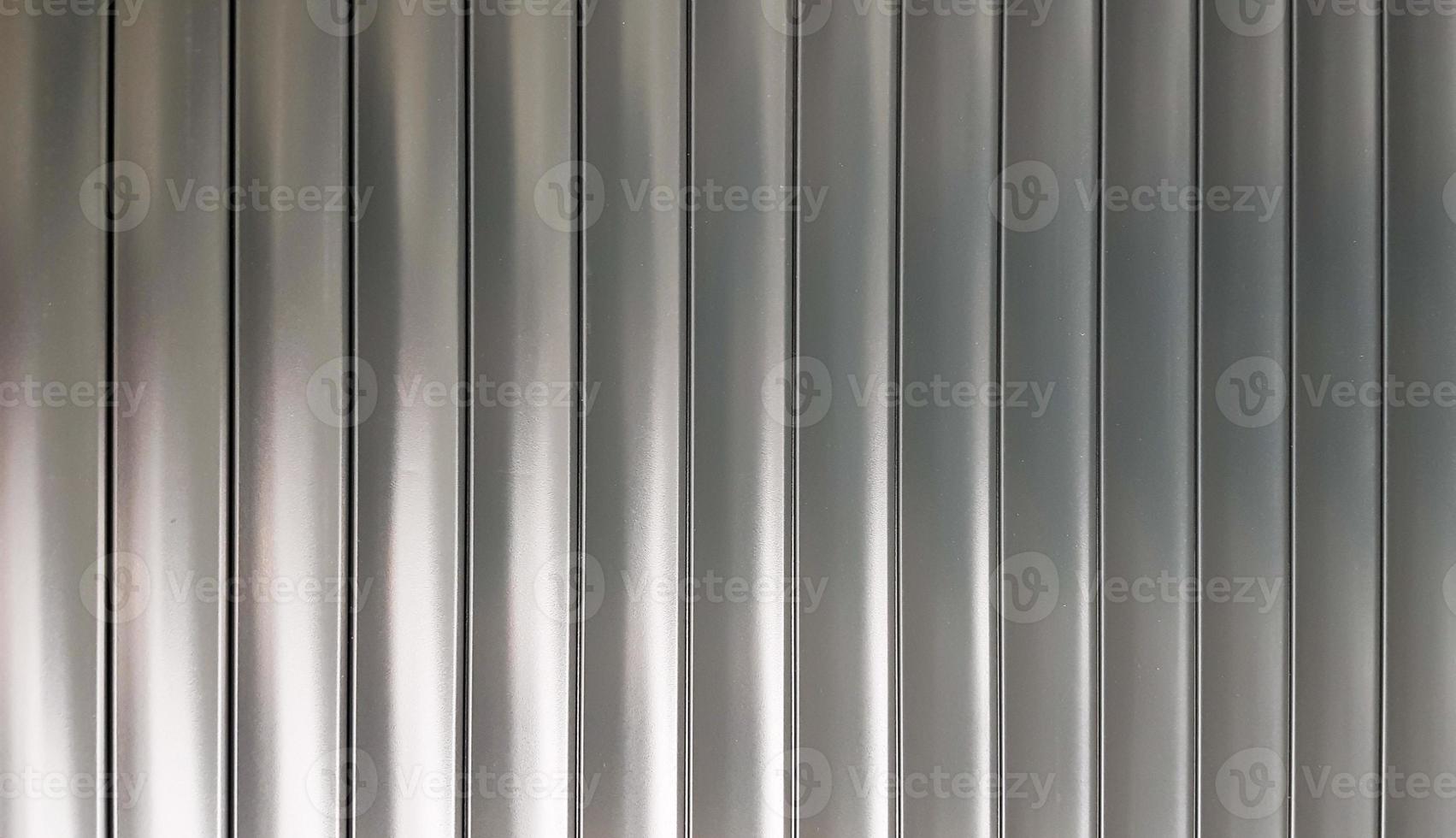 texture blinds or roleta. horizontal metallic blinds gates closed striped silver. Aluminum metal texture abstract background. photo