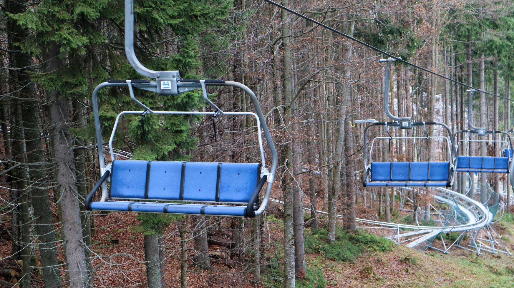 Ukraine, Bukovel - November 20, 2019. Autumn view of the ski resort with a chairlift against the background of autumn mountain slopes and the infrastructure under construction of a winter ski resort. photo