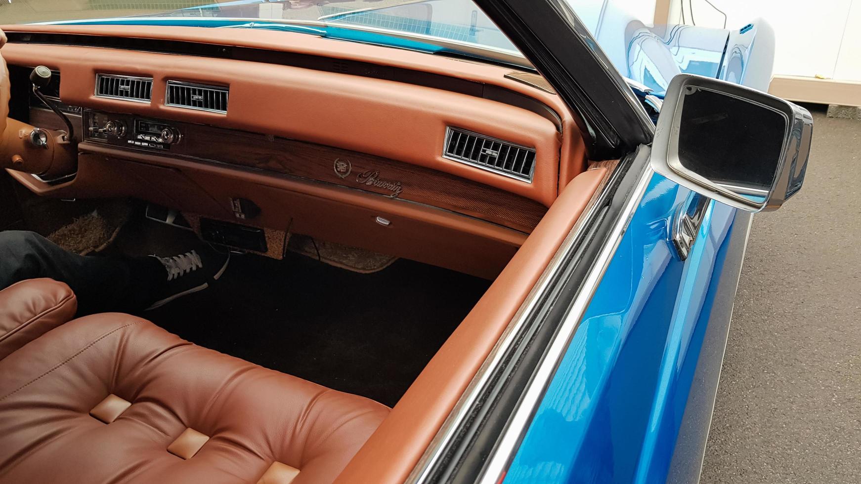 Ukraine, Kiev - March 27, 2020. vintage retro classic car Cadillac beatriz of blue color. emblem on the hood with a logo. original parts of the restored American car. photos from different angles.