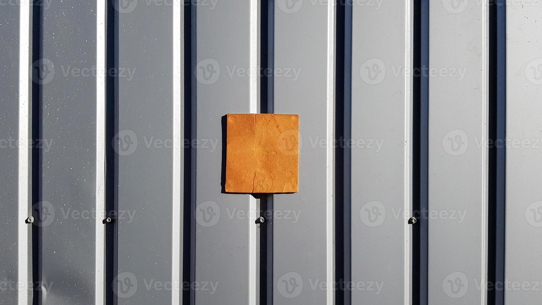 Metal sheet for roofing and background wall. Curve metal texture, table of steel sheet. Selective focus Texture for art backdrop add text or graphic design. Corrugated metal sheet door in silver photo
