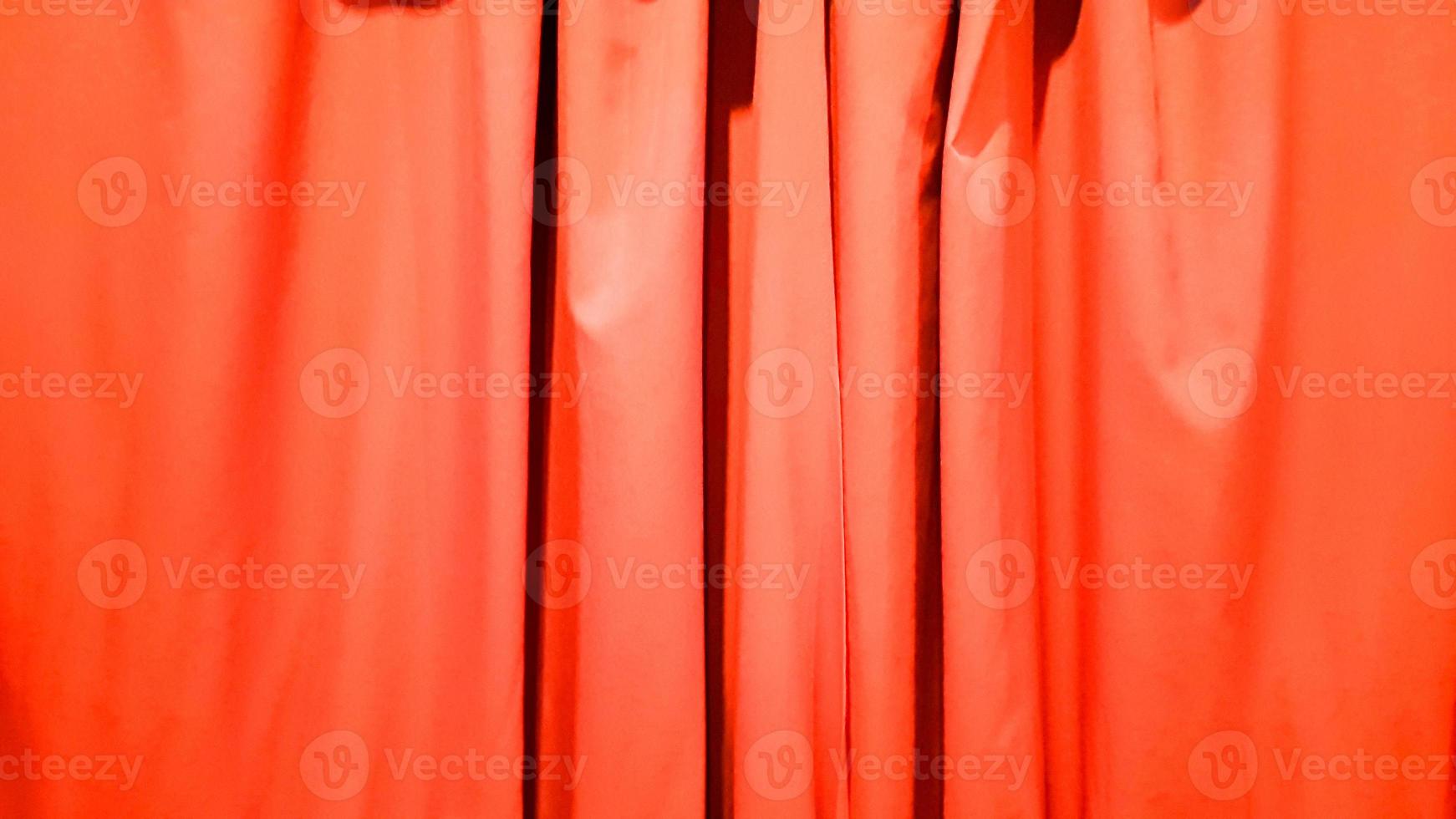 Red curtain use for background. Silk Cloth Background, Red Satin Fabric Waves, Abstract Texture. Red concert curtain full of folds photo