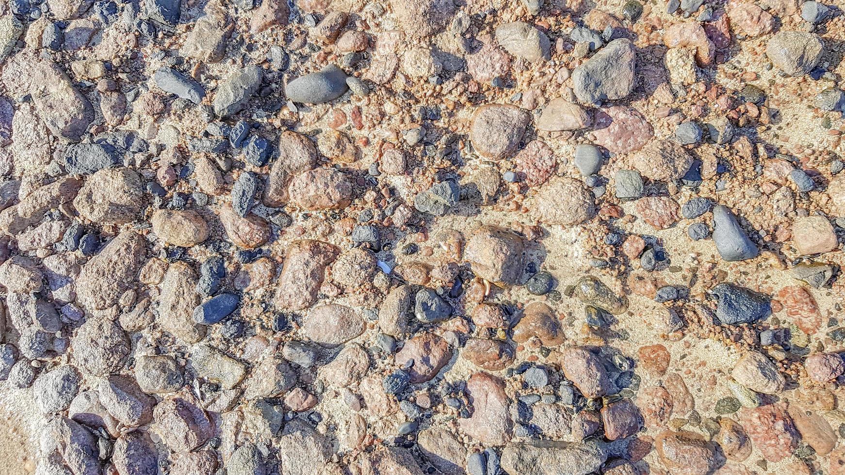 Background of Red sea water surface and sandy bottom. Sandy sea floor with structure of sunlight in the red sea. photo