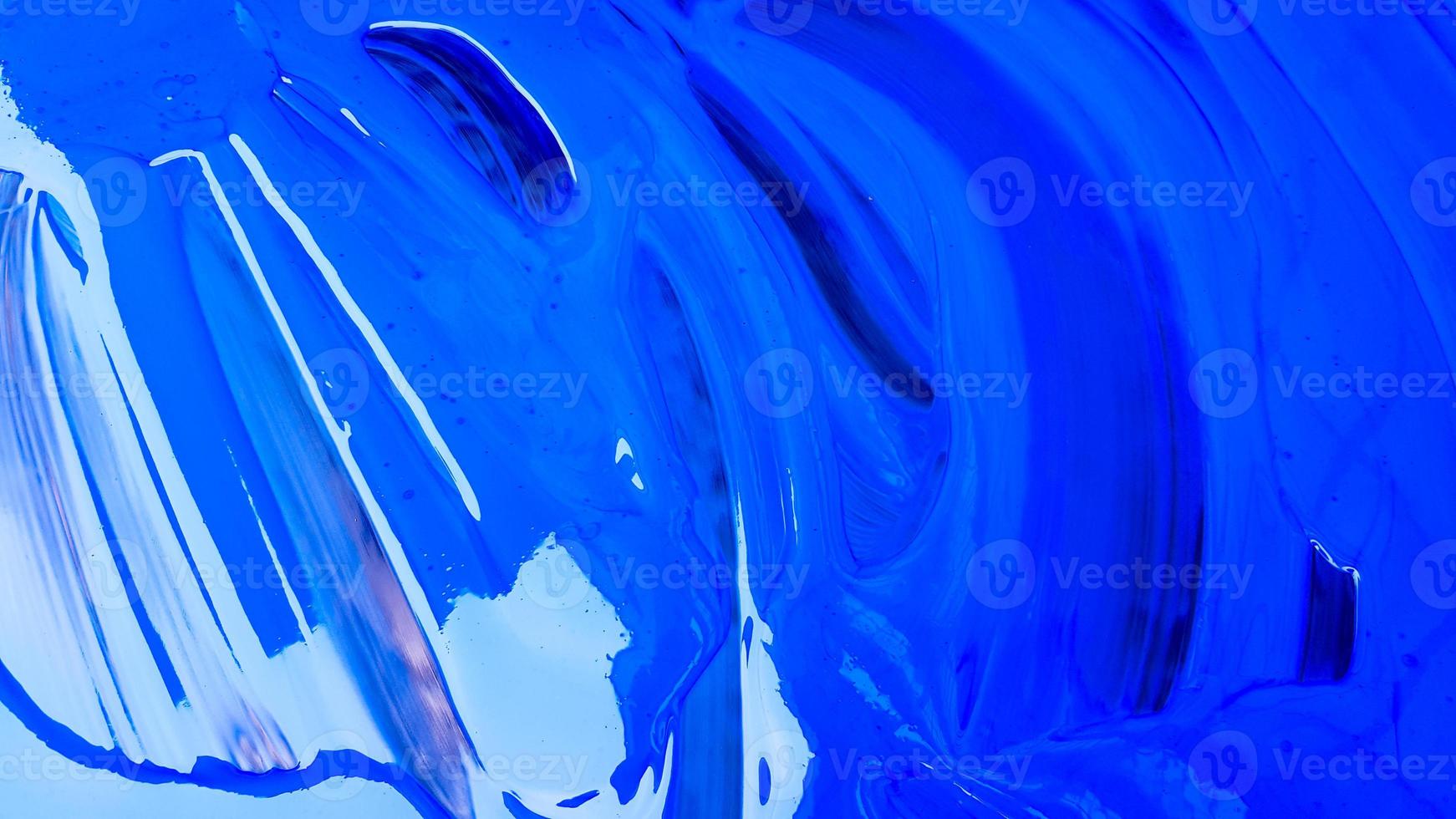 Abstract background of spilled blue paint with buckets on a black background. Blue paint is pouring on a black background. Use it for an artist or creative concept. Paints spilled blue background photo