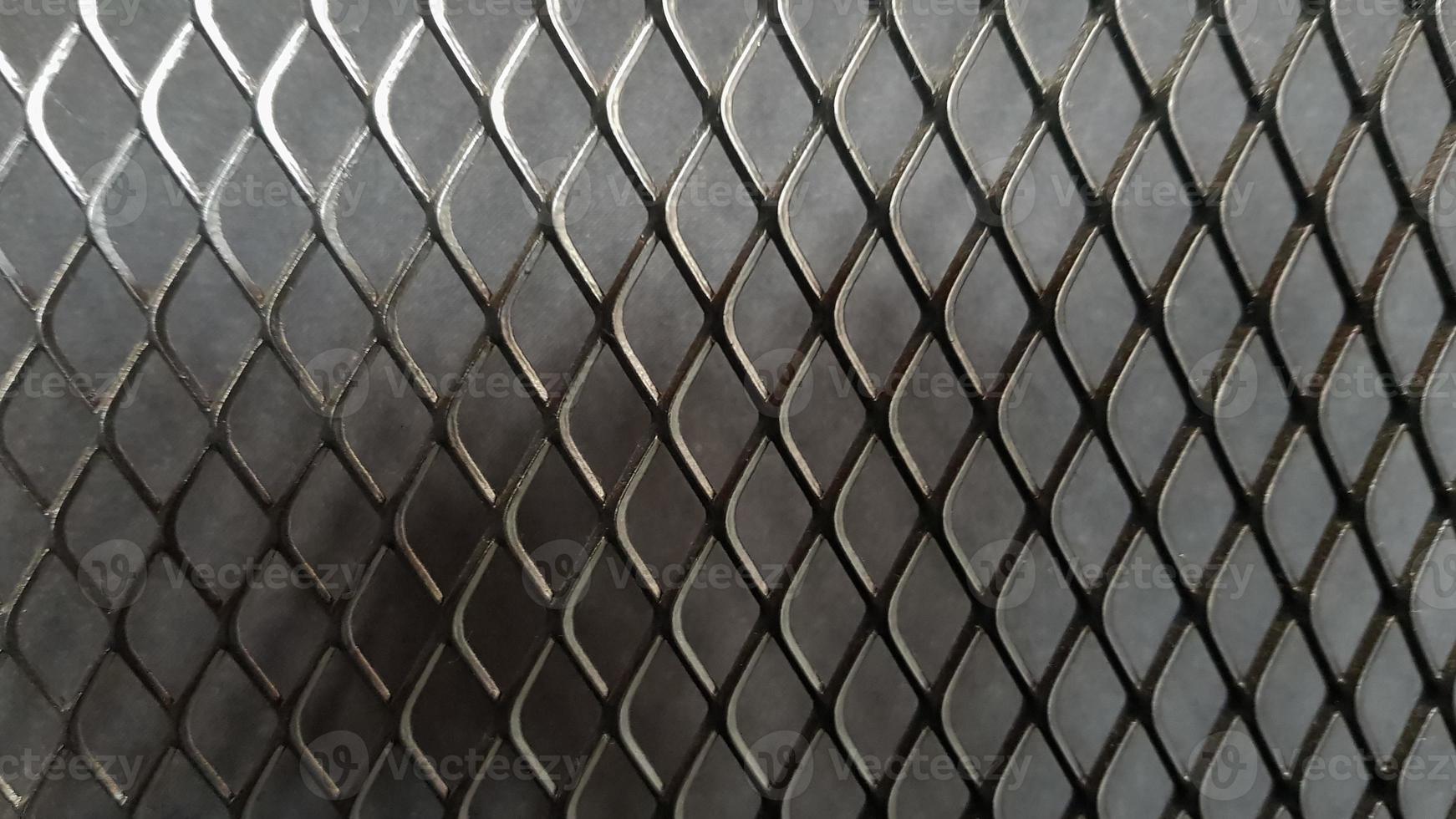 https://static.vecteezy.com/system/resources/previews/004/537/283/non_2x/metal-mesh-seamless-pattern-black-metal-mesh-texture-on-a-black-background-bulletin-board-for-text-and-message-design-rhombus-shape-photo.jpg