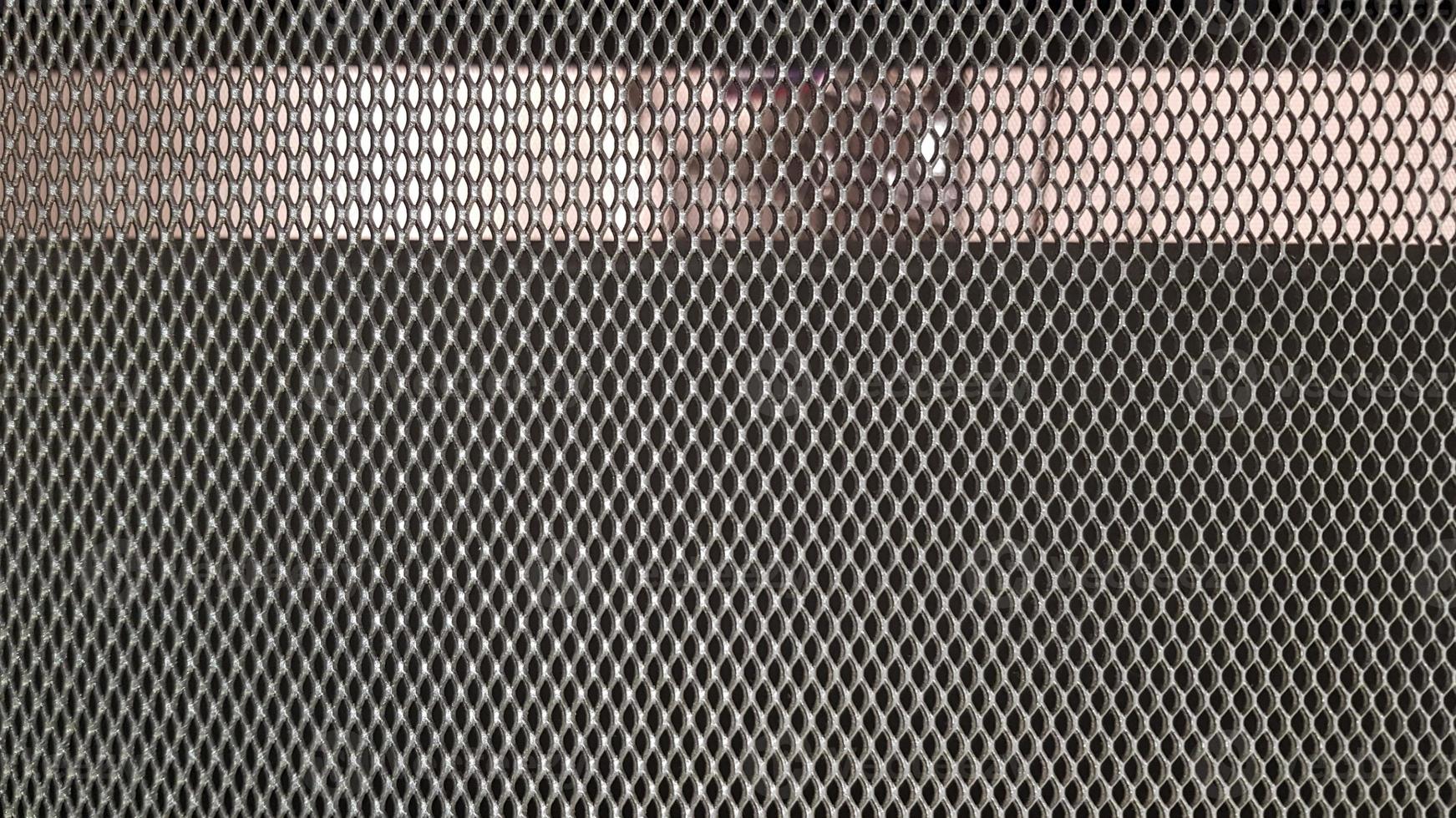 Abstract industrial metallic netting background, pattern, texture. Mesh gray background photo