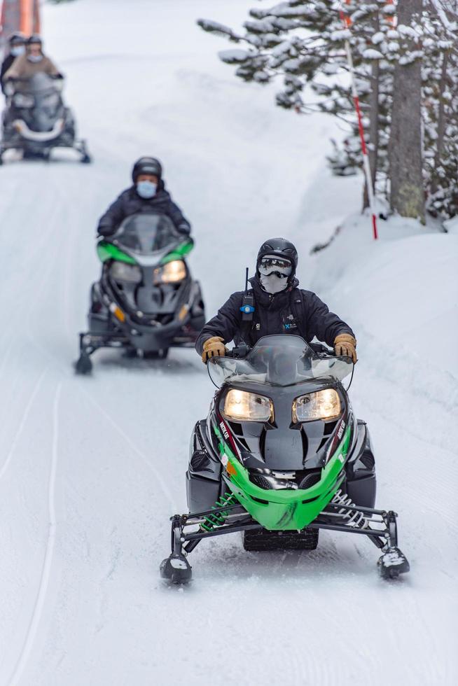 Grandvalira, Andorra . 2021 March 1 . Young people driving snowmobiles at the Grandvalira station, Grau Roig Andorra. photo