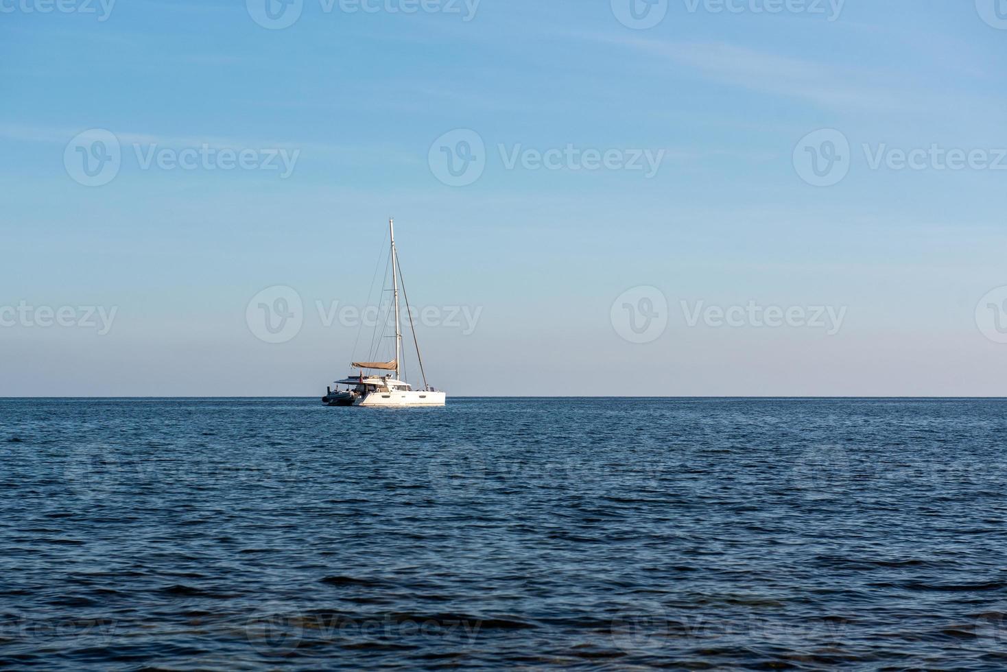 Sailboat off the coast of Formentera in the Mediterranean in Spain. photo