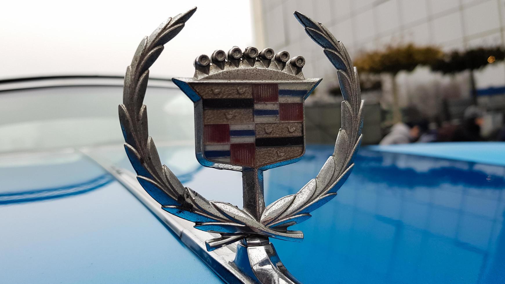Ukraine, Kiev - March 27, 2020. vintage retro classic car Cadillac beatriz of blue color. emblem on the hood with a logo. original parts of the restored American car. photos from different angles.