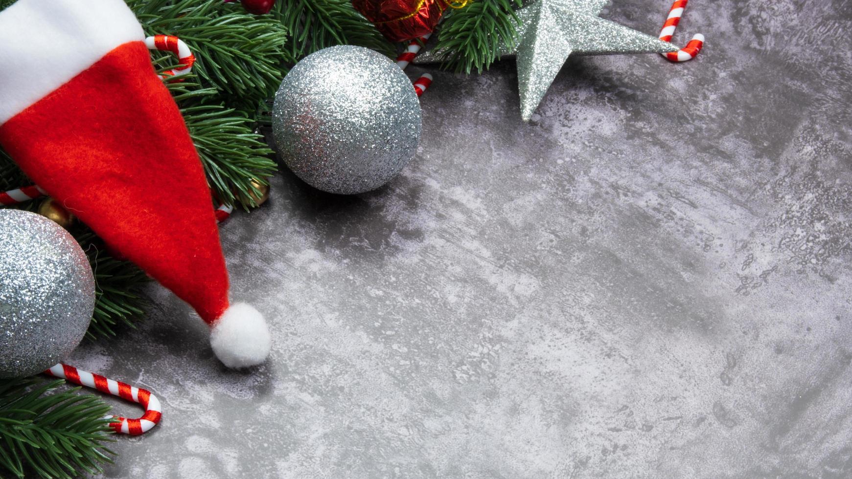 Christmas decorations, pine tree leaves, balls, berries on grunge background, Selective focus christmas concept photo