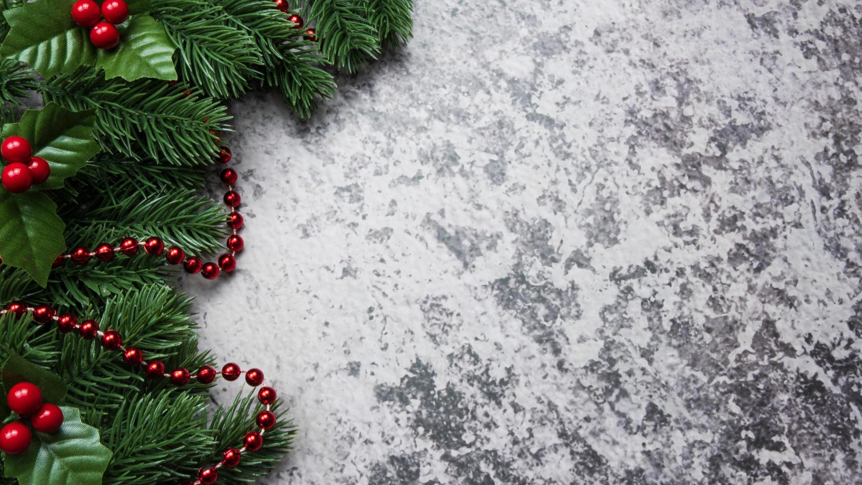 Christmas decorations, pine tree leaves, balls, berries on grunge background, Selective focus christmas concept photo