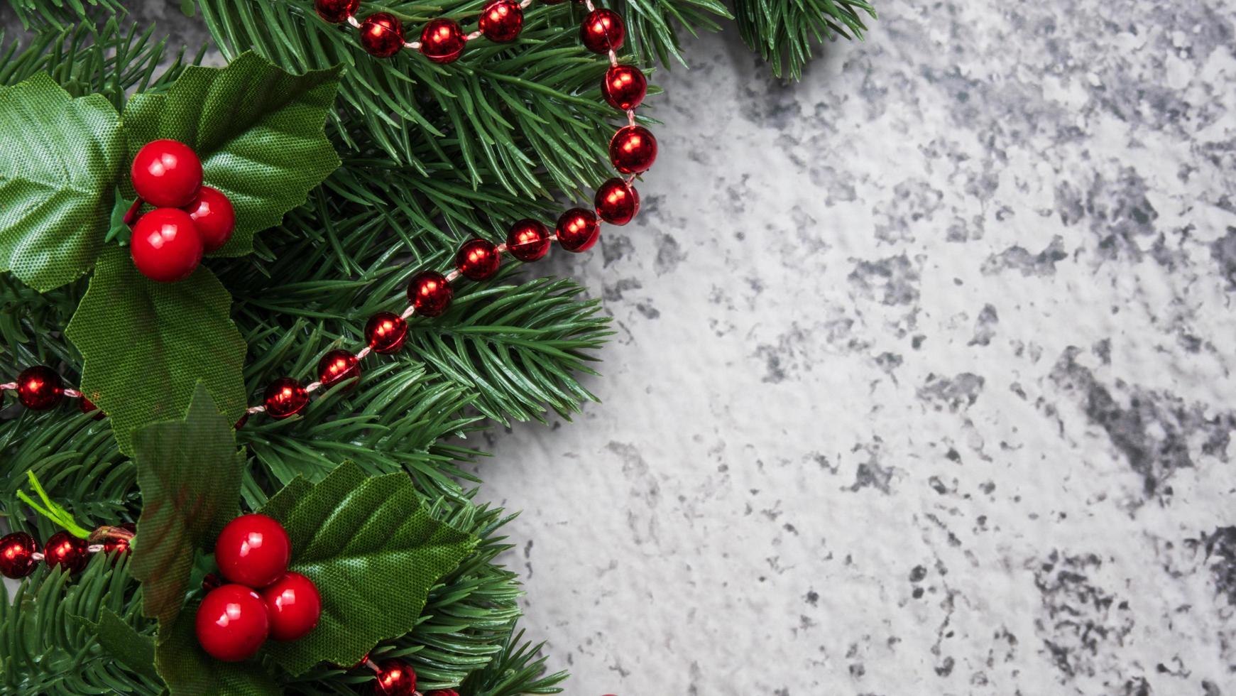 Christmas decorations, pine tree leaves, balls, berries on grunge background, Selective focus christmas concept photo