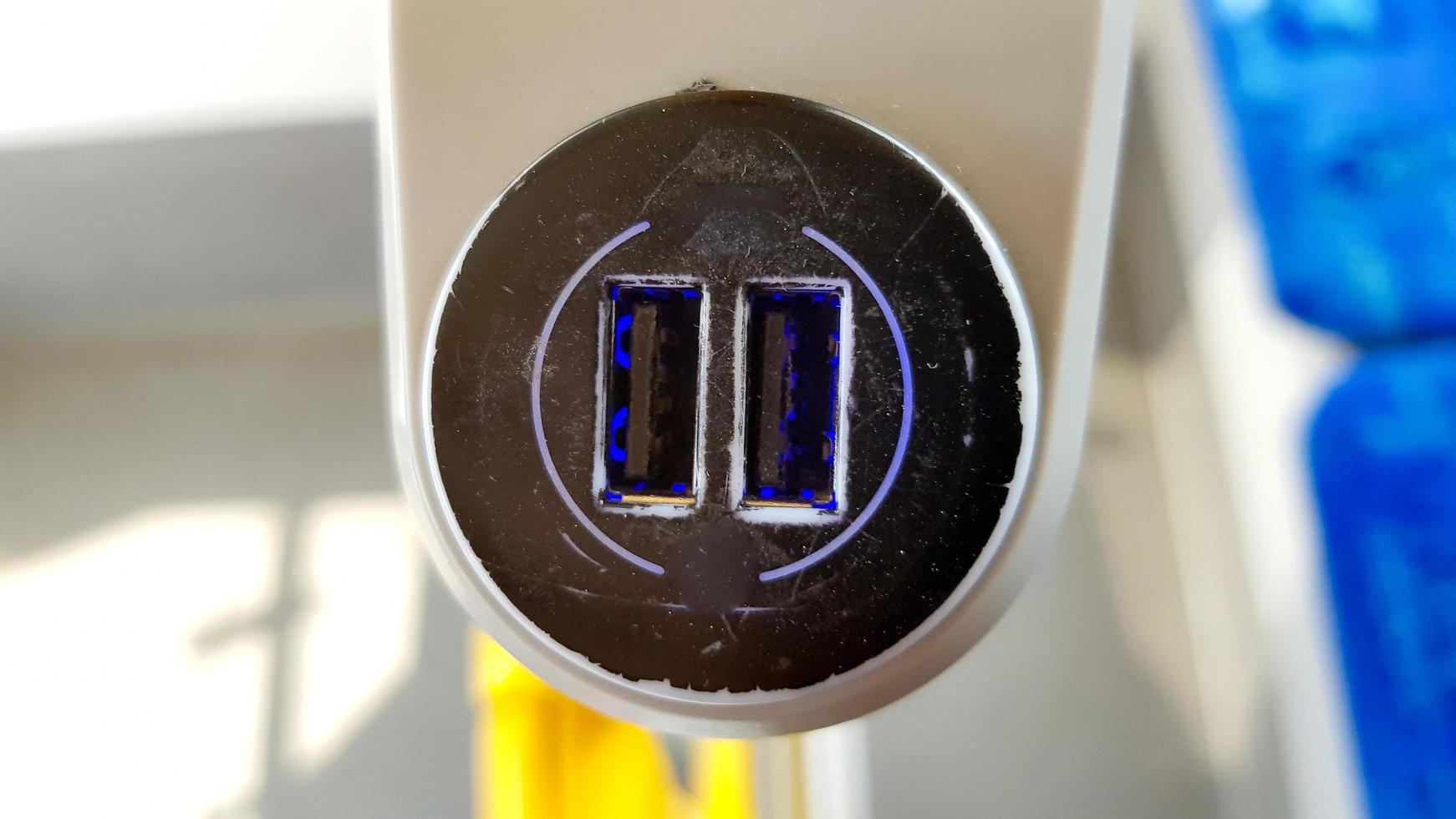 USB sockets in a tram car. USB port in a passenger carriage in Europe for charging gadgets and electronics photo