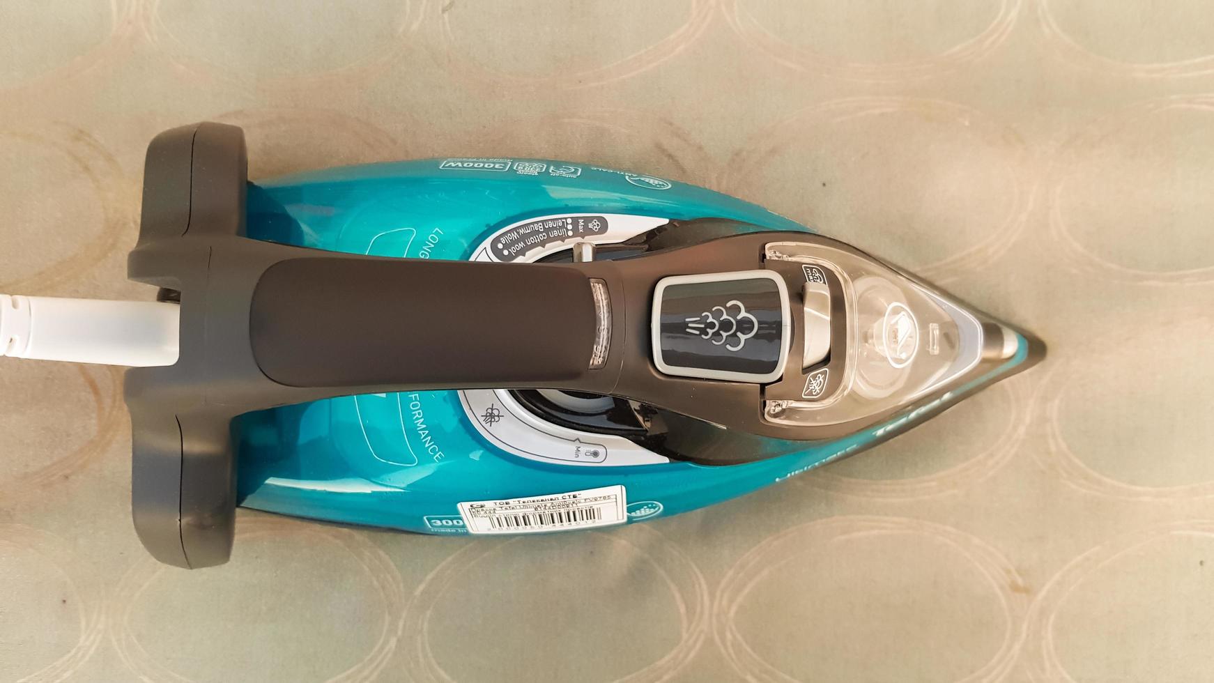 Ukraine, Kiev - May 09, 2020. Blue electric iron on an ironing board on the street. photo