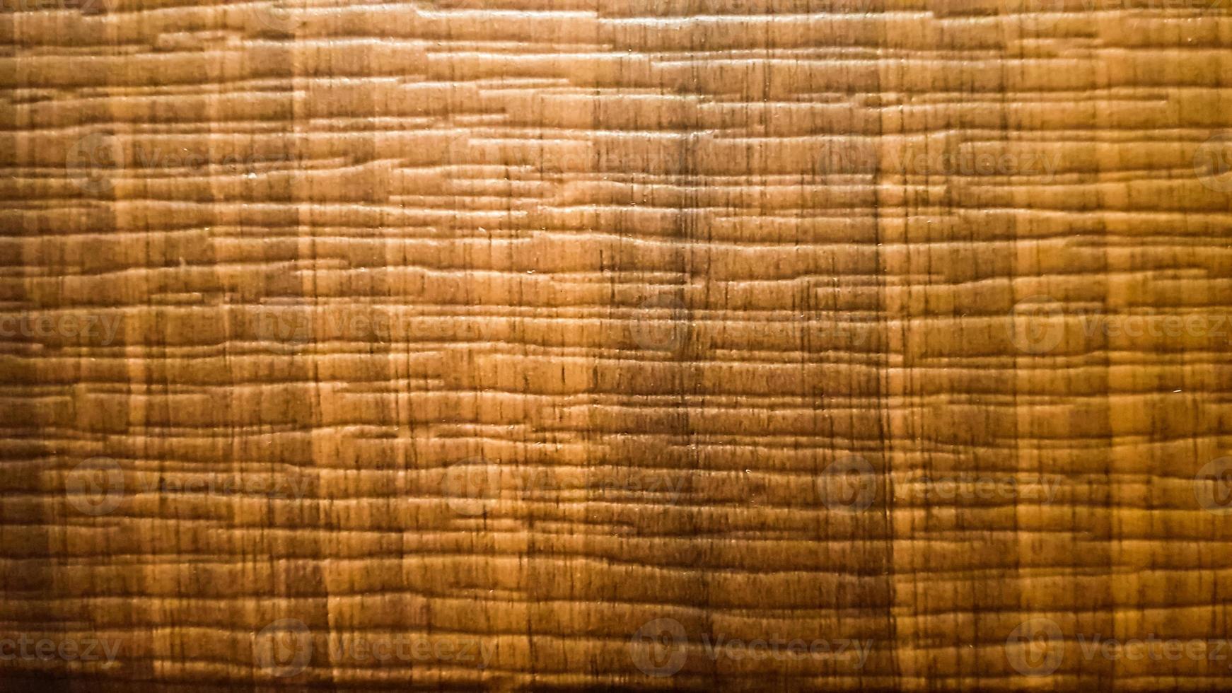 Brown wood grain table or parquet texture. Wooden background. brown rippled wood texture with waves photo