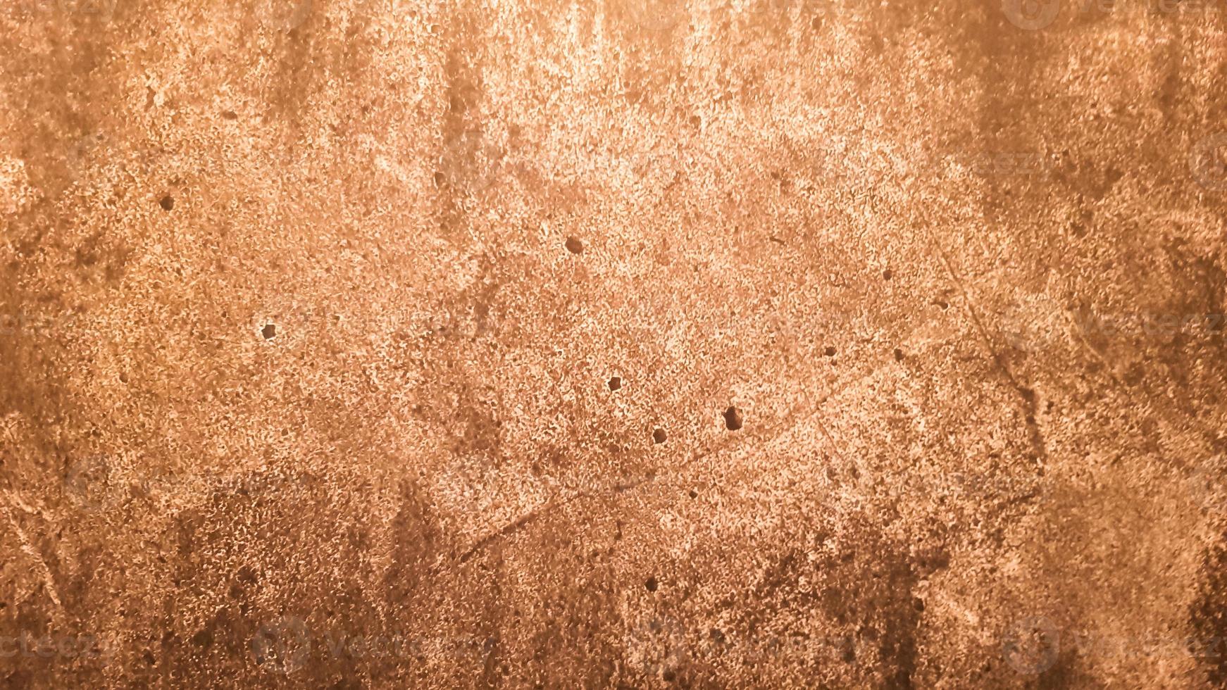 textura de piedra de granito. Fondo de piedra dorada marrón. Superficie de pared de piedra vacía vieja o fondo de textura de papel marrón sucio antiguo marrón o beige. grunge de oro marrón. foto