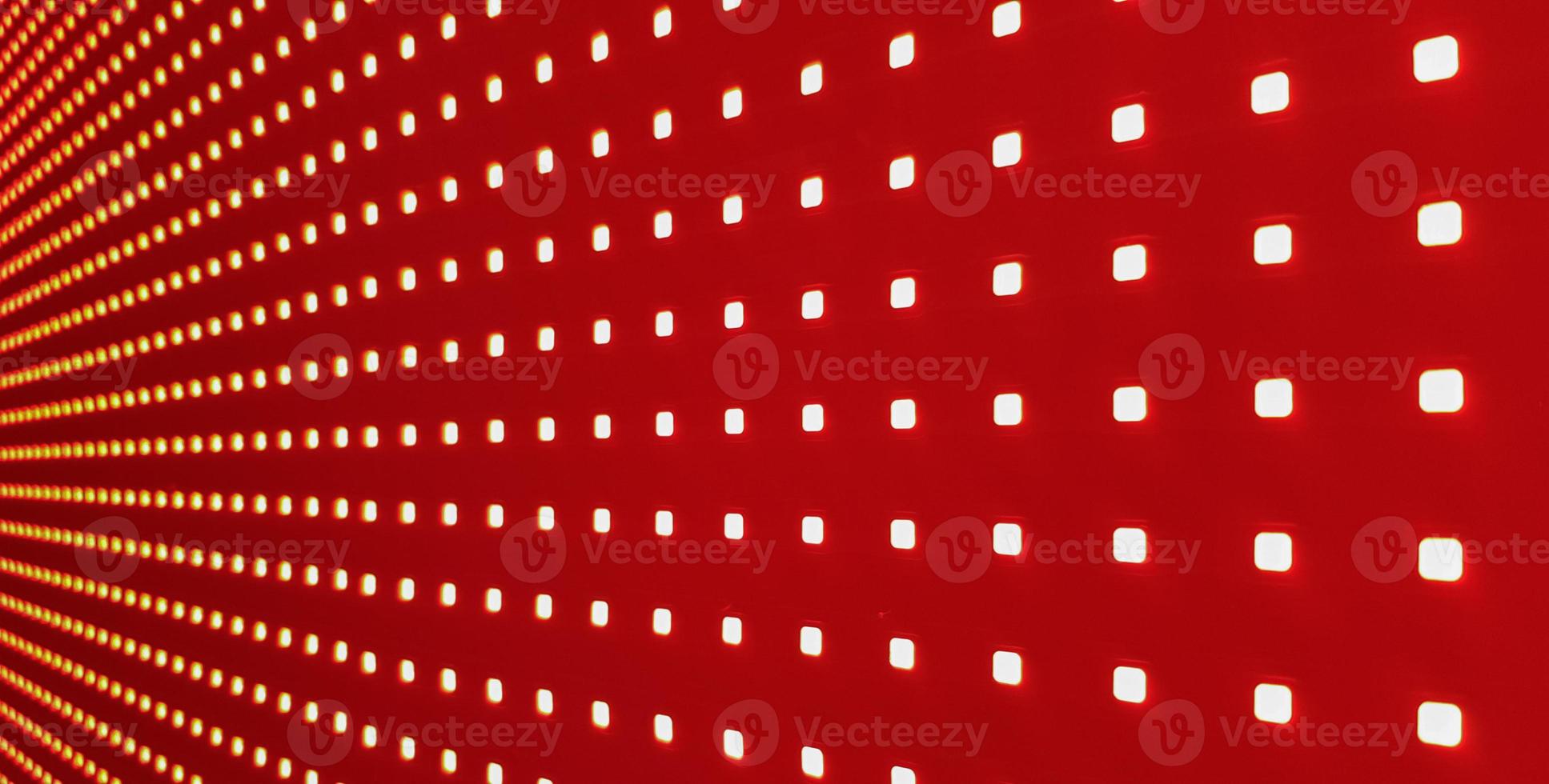 RGB LED screen panel texture. Close-up of a pixel LED screen with bokeh for wallpaper. Bright red abstract background perfect for any design. photo