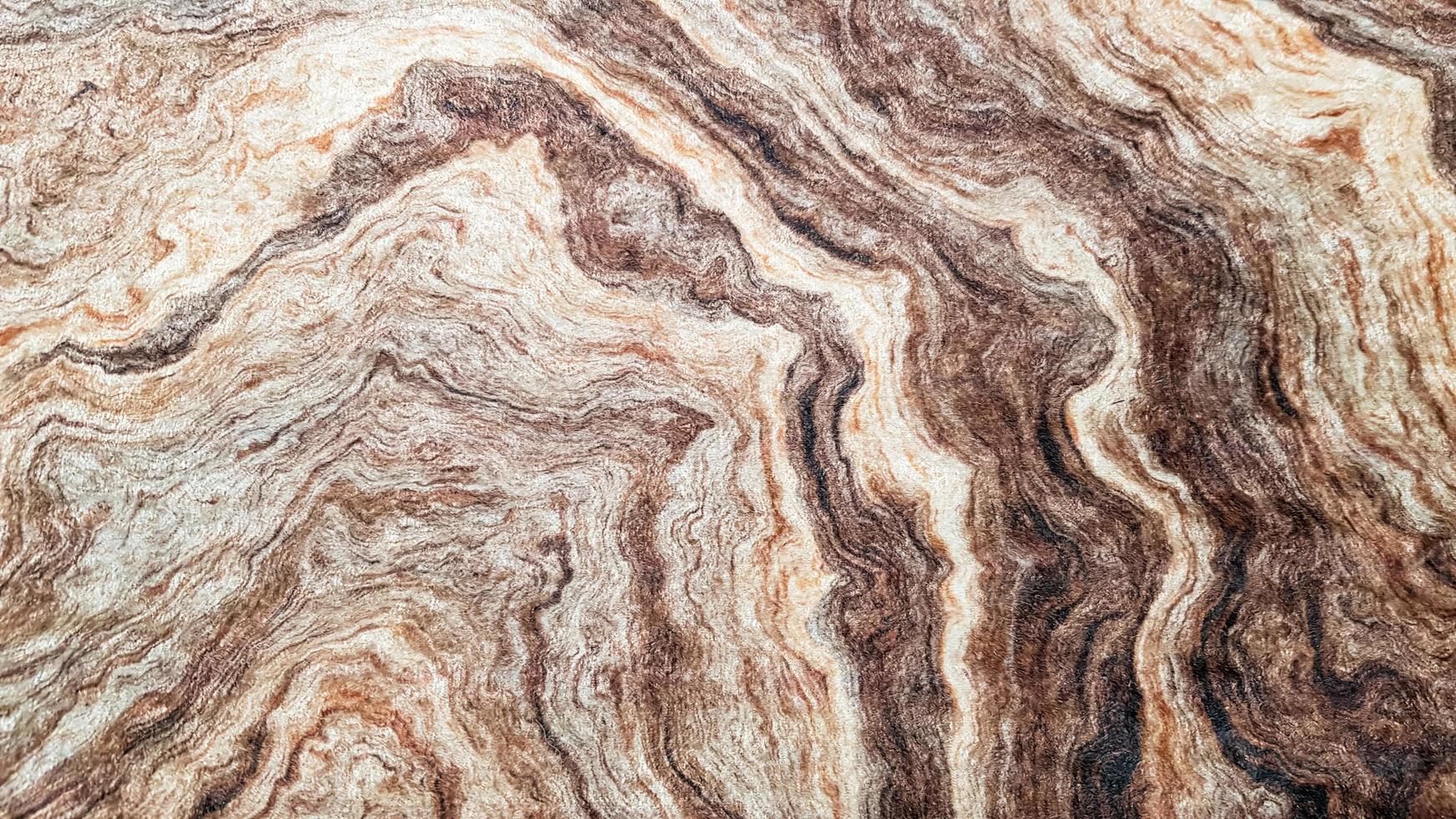 The surface of Sandstone with wavy brown veins. Sulphide agate texture. Wide image of brown natural stone texture Sphalerite. Beautiful wavy pattern of cut of Schalenblende stone close-up photo