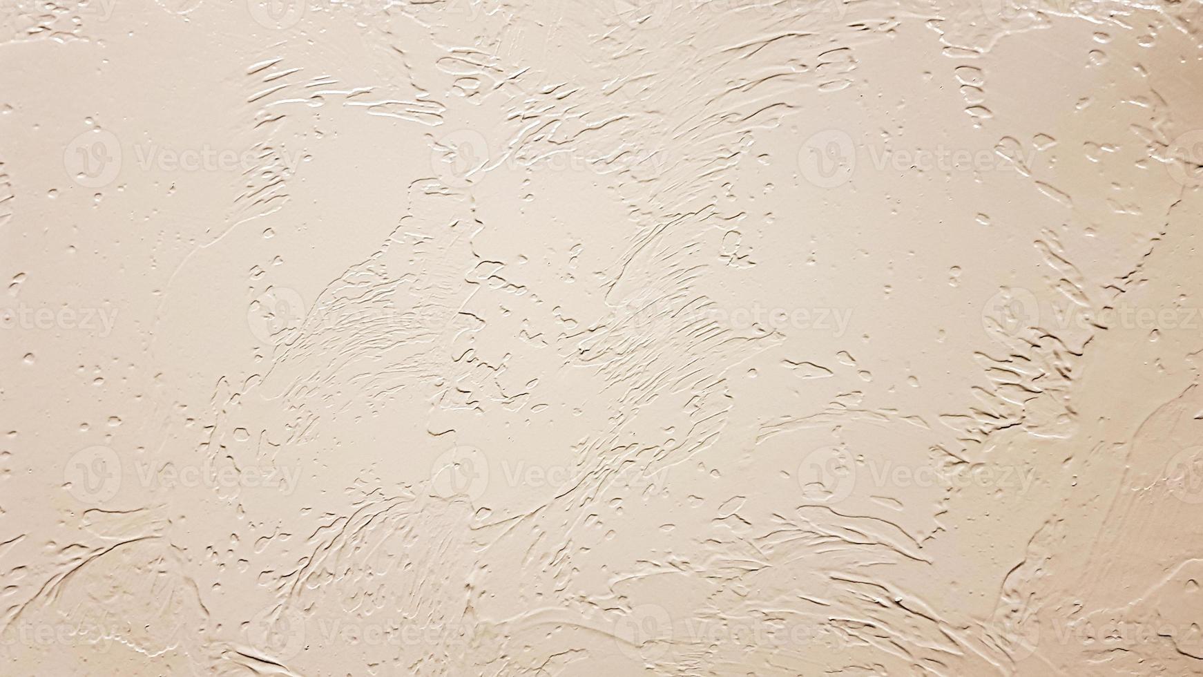 Light textured plaster as a background. Decorative plaster effect on wall. Textured background. Decorative plaster walls, external decoration of facade. Texture of beige. photo