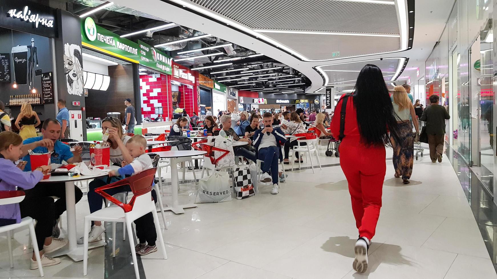 Ukraine, Kiev - September 04, 2019. crowded food court in a shopping center. People relax and eat at a food court in a shopping center photo