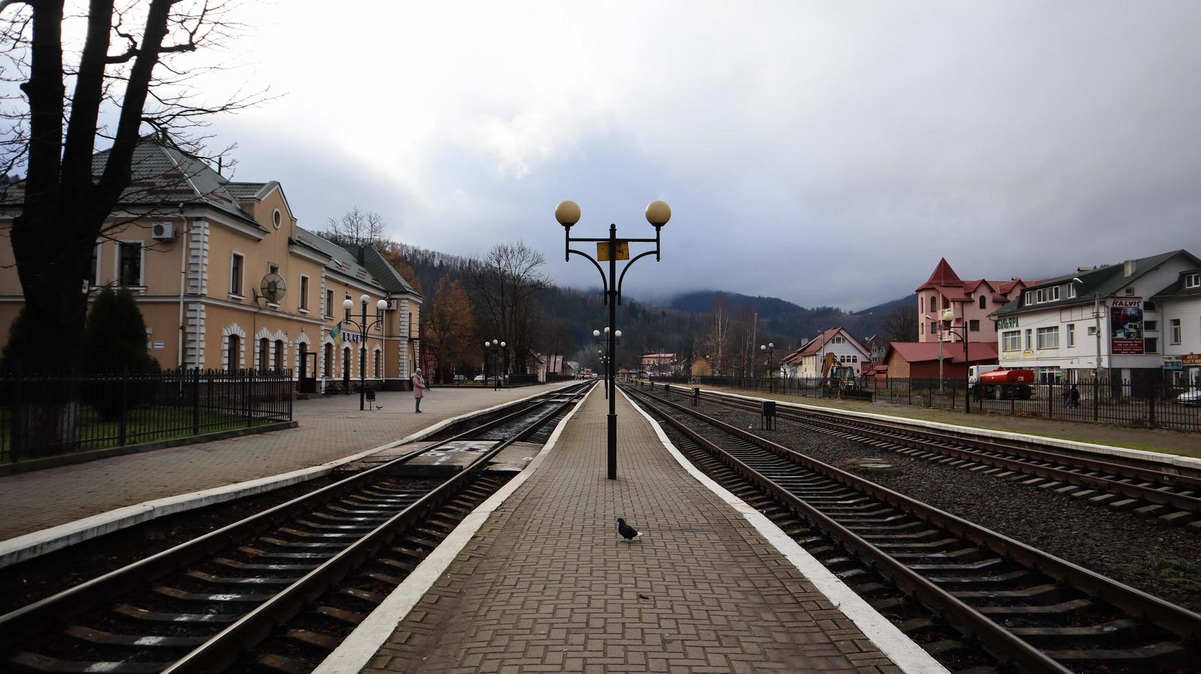 Ukraine, Yaremcha - November 20, 2019. the railway station of the village of Yaremche in the Carpathians. Old train station on an early cloudy morning. beautiful scenery in the mountains. photo