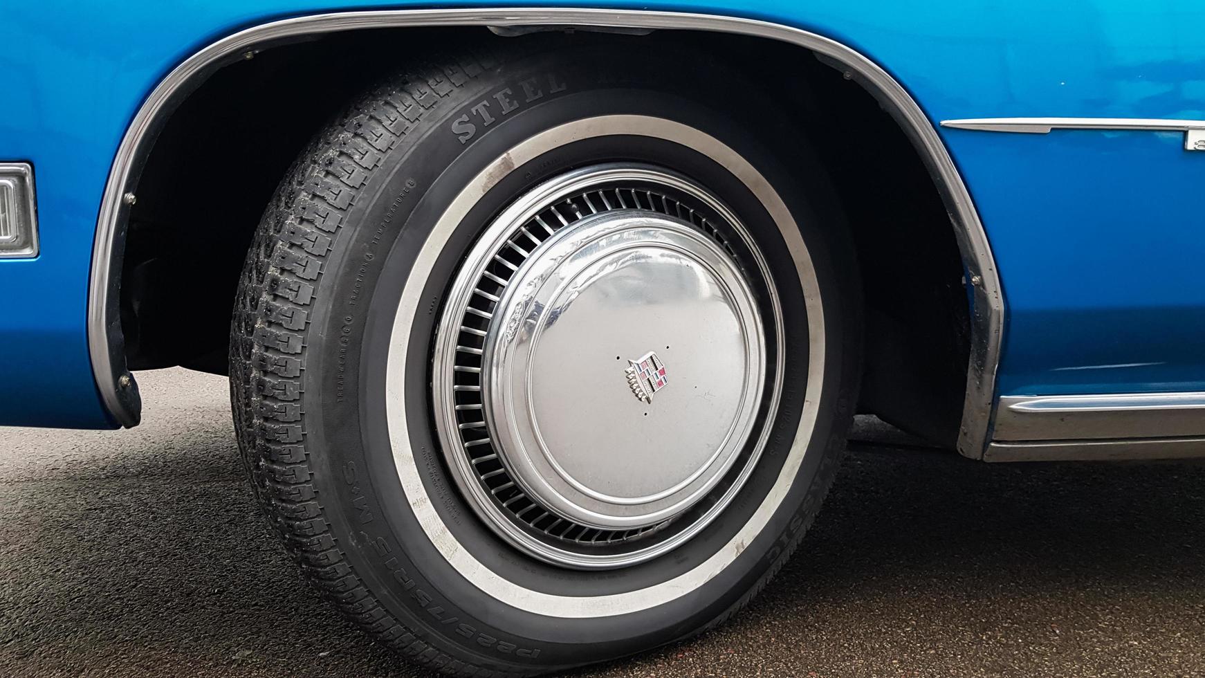 Ukraine, Kiev - March 27, 2020. vintage retro classic car Cadillac beatriz of blue color. emblem on the hood with a logo. original parts of the restored American car. photos from different angles.