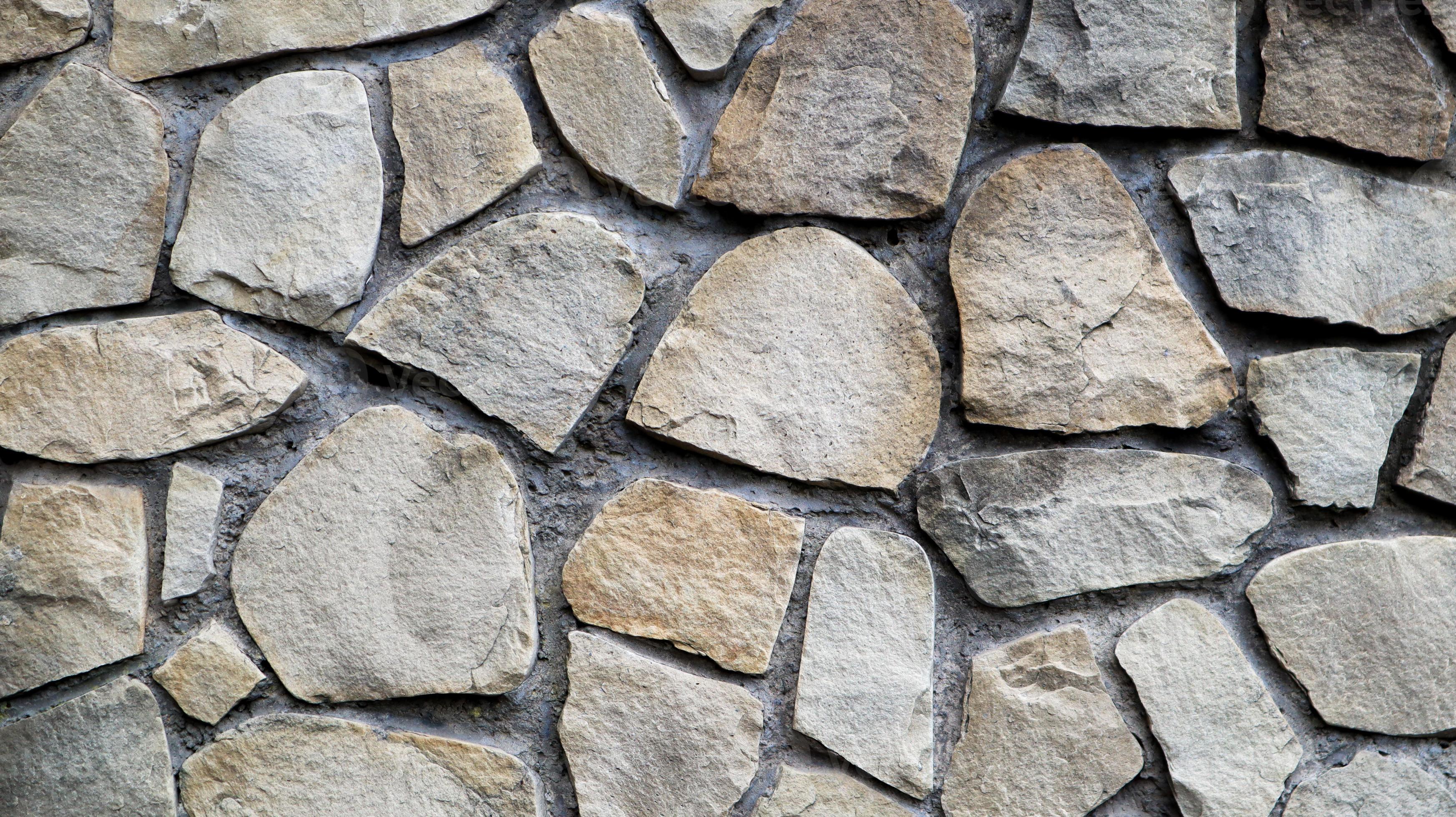 The texture of the stone wall. Old castle stone wall texture background. Stone  wall as a background or texture. Part of a stone wall, for background or  texture. pattern gray color modern