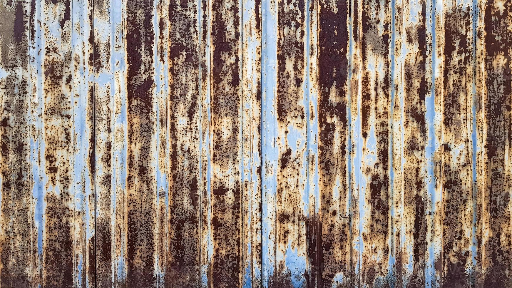 Dark shabby rusty metal texture background. Rusty metal surface with paint photo