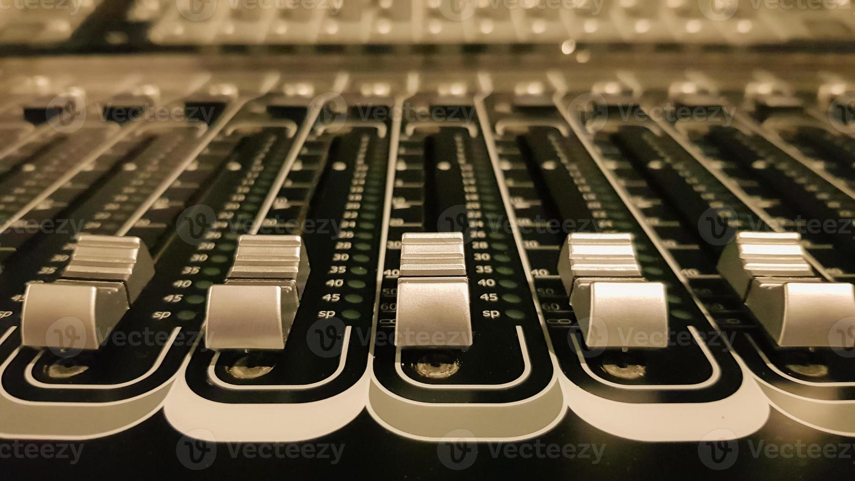 Audio sound mixer amplifier equipment, sound engineering acoustic musical mixing concept background, selective focus. Retro style machining. photo