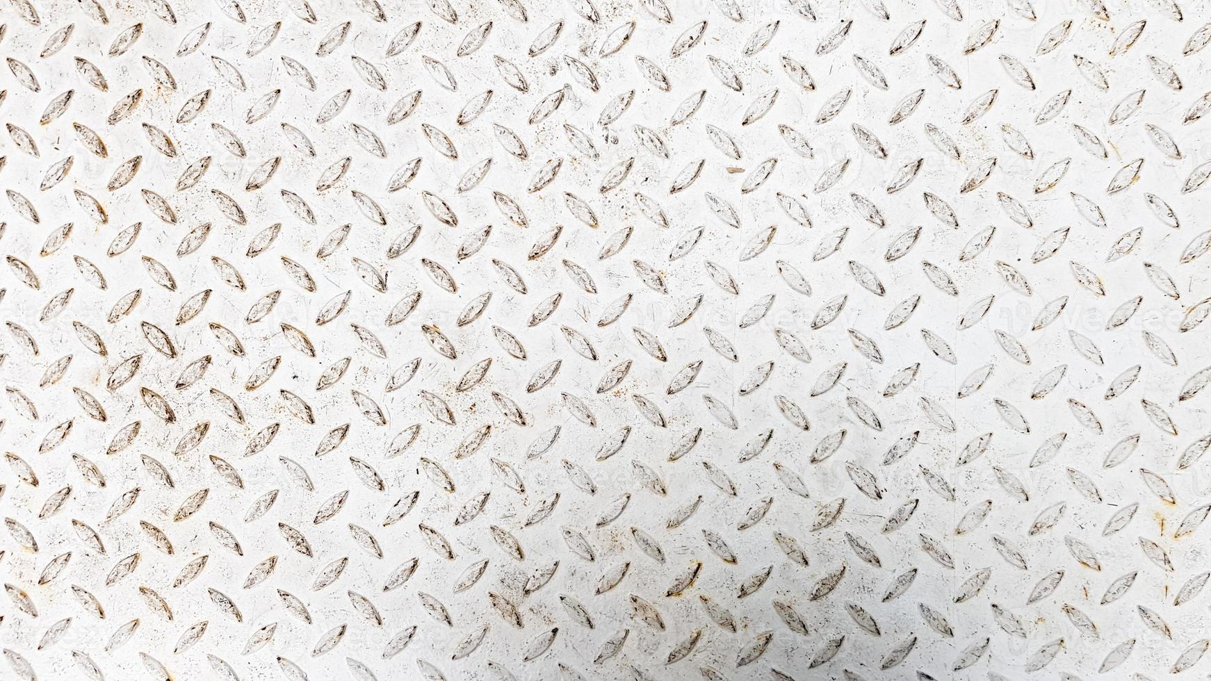 White steel sheet with embossed diamond pattern, used for floors and industrial building. White vintage steel plate useful as background photo