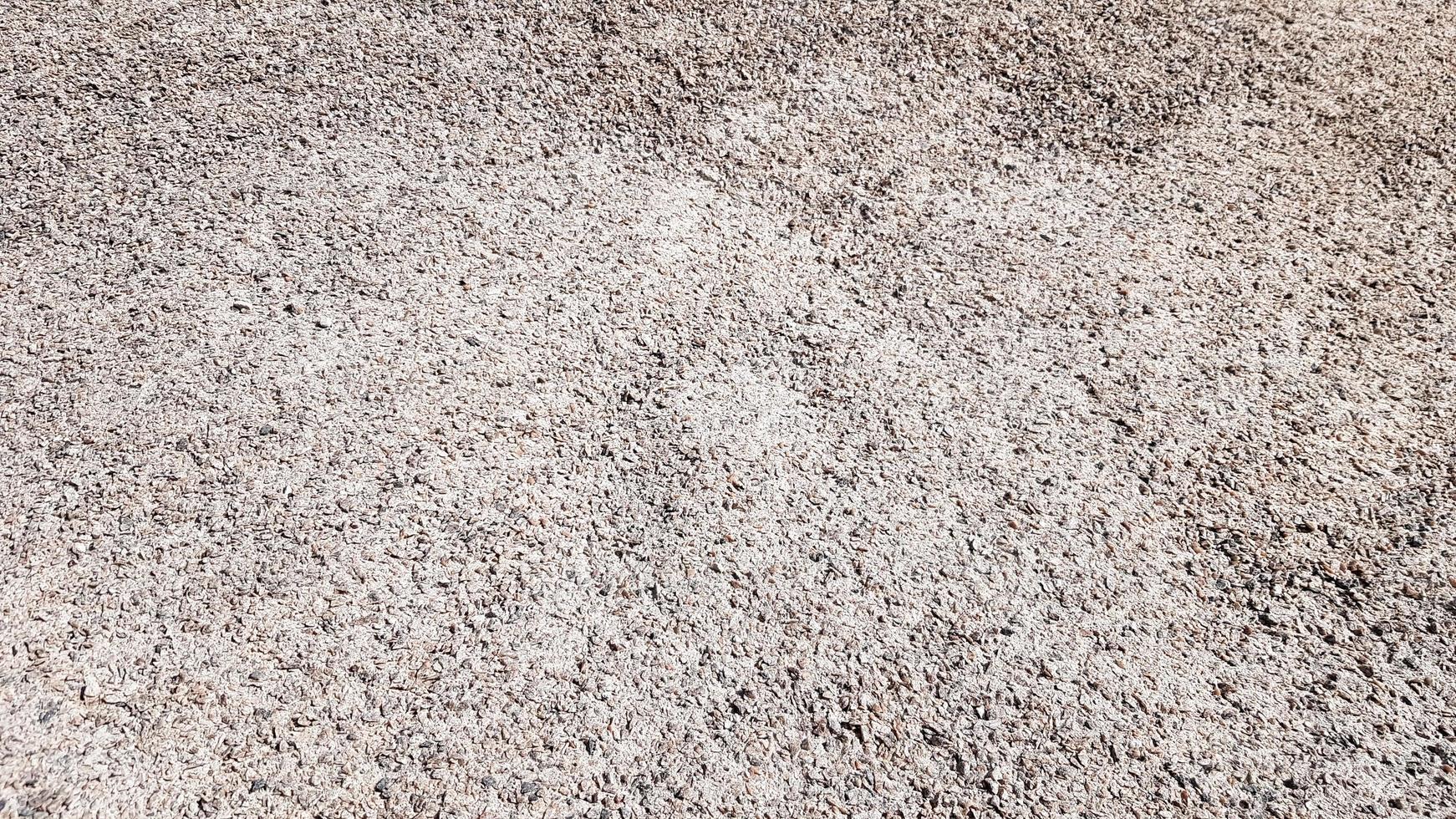 Crushed gravel texture background in natural light. Fine gray gravel for background or texture. Natural building material for road construction or landscape architecture. Construction industry photo