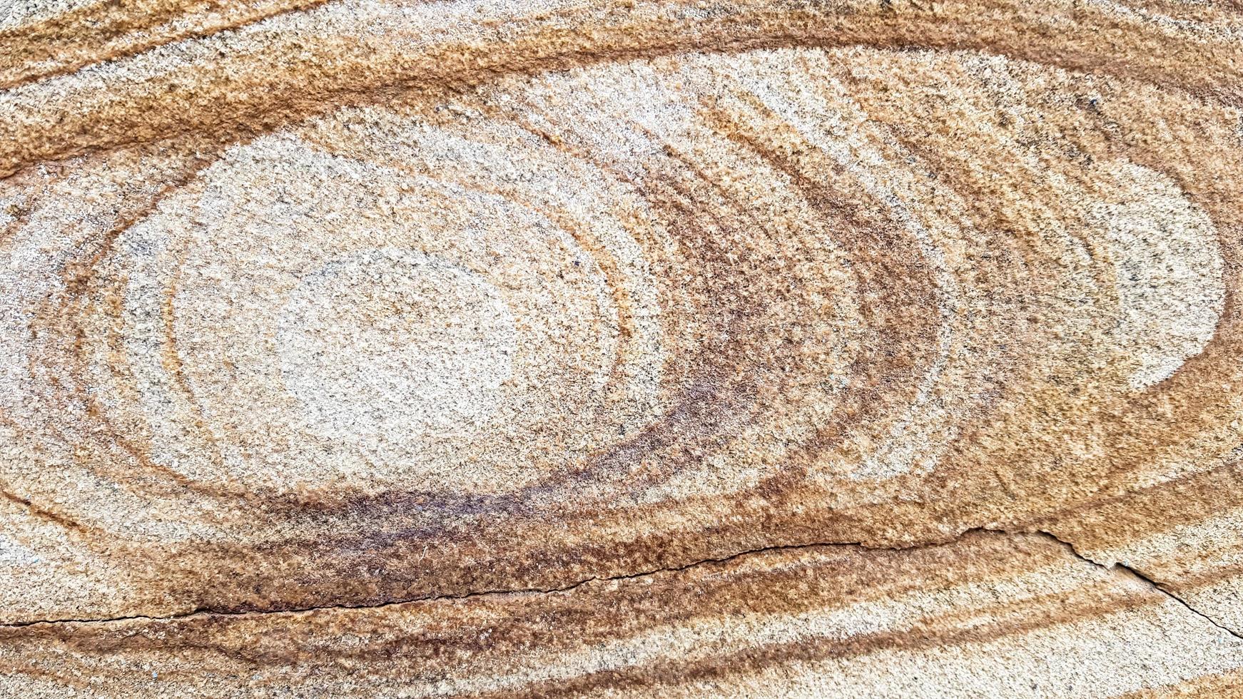 The surface of Sandstone with wavy brown veins. Sulphide agate texture. Wide image of brown natural stone texture Sphalerite. Beautiful wavy pattern of cut of Schalenblende stone close-up photo