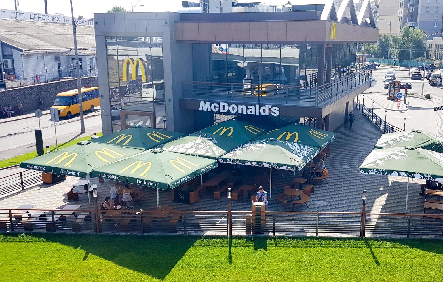 Ukraine, Kiev April 16, 2019. McDonald's restaurant in Kiev, Ukraine. McDonald's is an American chain of fast food restaurants and hamburgers. Top view from the bridge to the restaurant photo