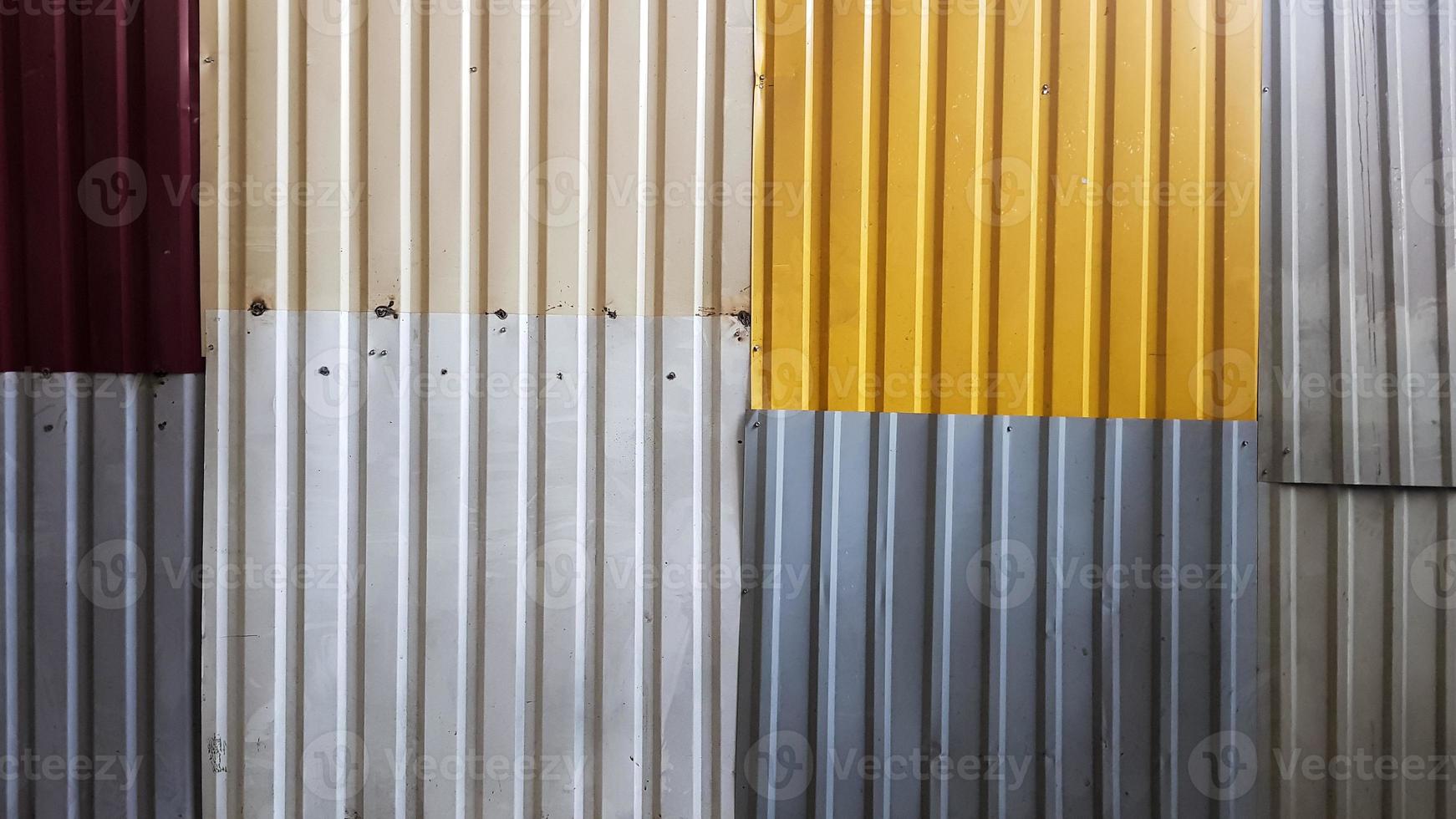 Rusty sheets of corrugated iron in different colors. Texture background of  brown, gray, yellow, green corrugated fence. Colorful galvanized sheet.  Background image of corrugated metal sheets 4542924 Stock Photo at Vecteezy