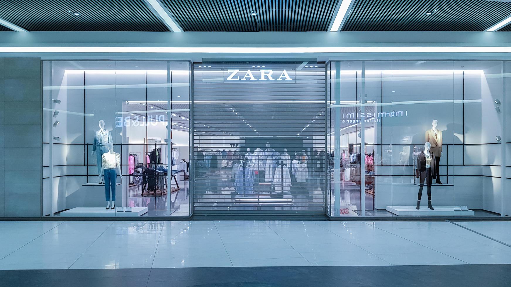 Ukraine, Kiev - May 09, 2020. Locked doors of the Zara fashion store during the Covid 19 pandemic. Mobile photography. Closing of the quarantine shopping center and retail stop. photo