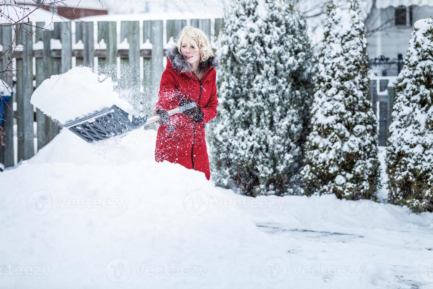 Woman Shoveling her Parking Lot photo