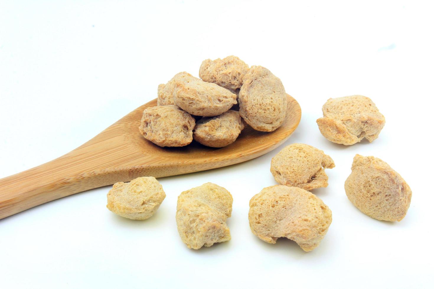 Soy meat in chunks on white background. Raw soybeans chunks photo