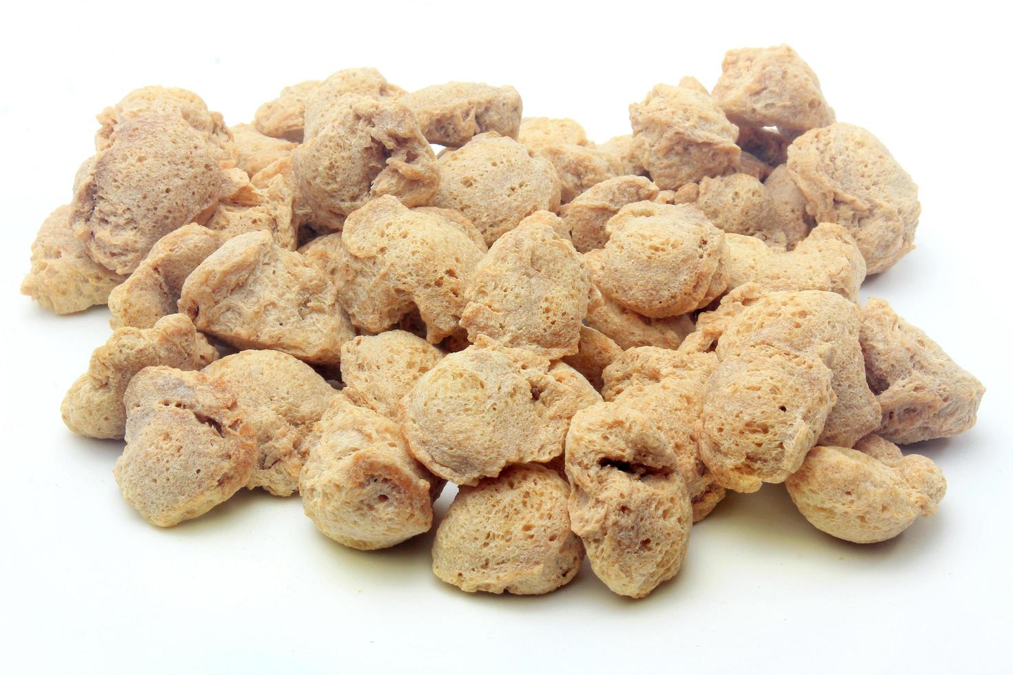 Soy meat in chunks on white background. Raw soybeans chunks photo