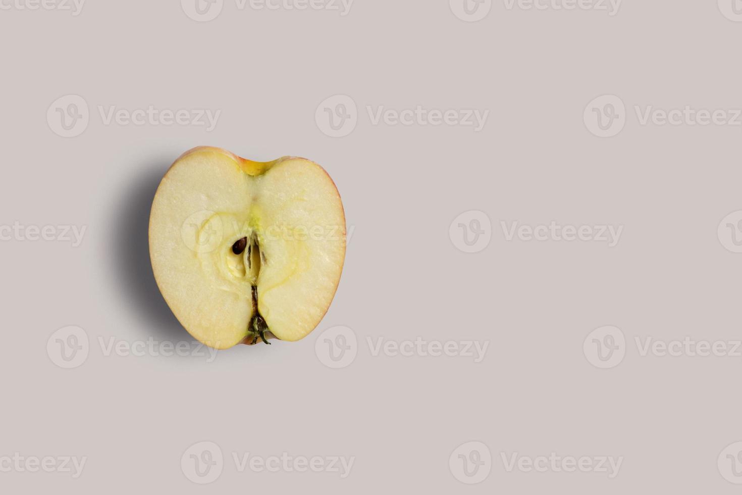 Top up up view fresh half red apple isolated on grey background. suitable for your design project. photo