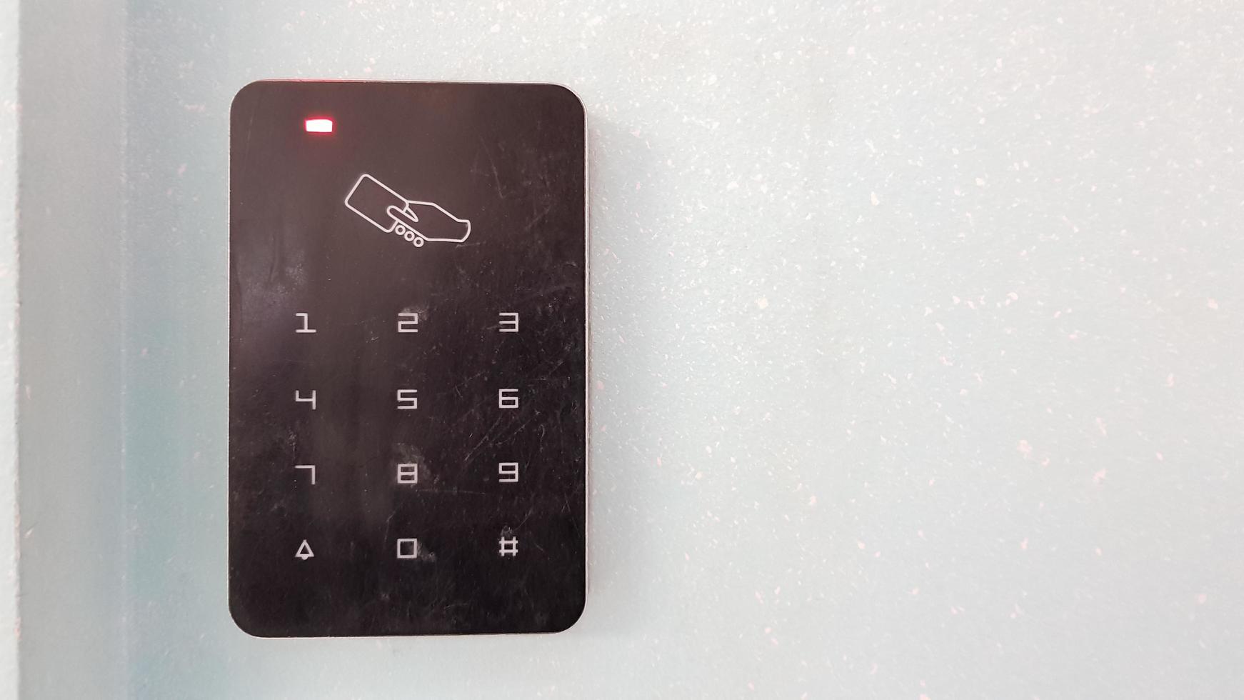 Electronic lock on the wall with copy space. Digital security systems for door security. Selective focus. photo