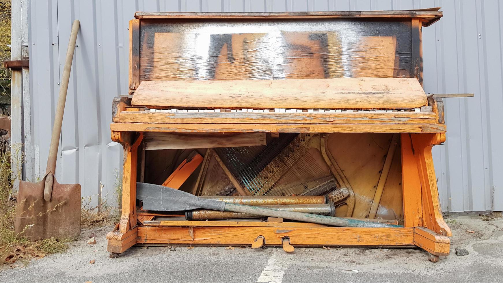 Closeup of a broken piano keyboard of an old piano. photo