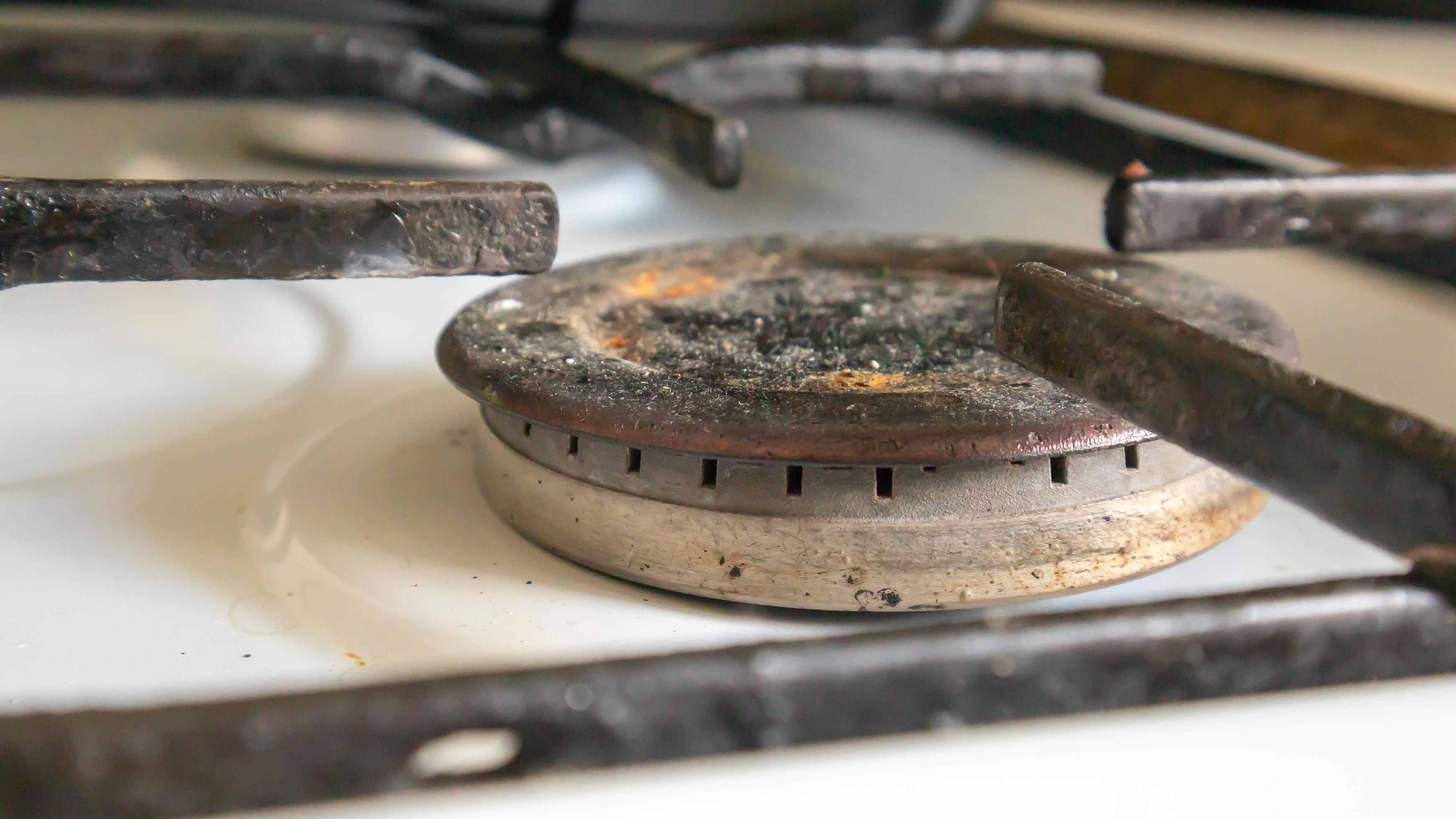 Dirty gas stove in the kitchen for cooking with vegetable oil stains