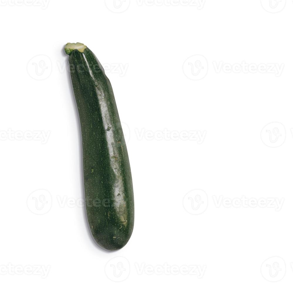Close up view of fresh green zucchini isolated on white background. added copy space for text. photo