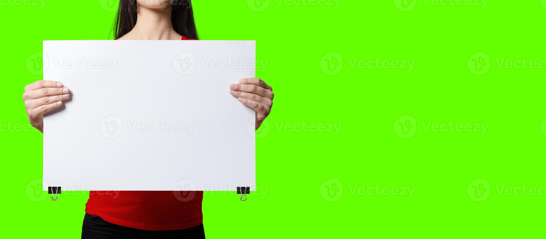 Beautiful Woman holding blank signboard on green screen background. suitable your element project. added copy space for text. photo