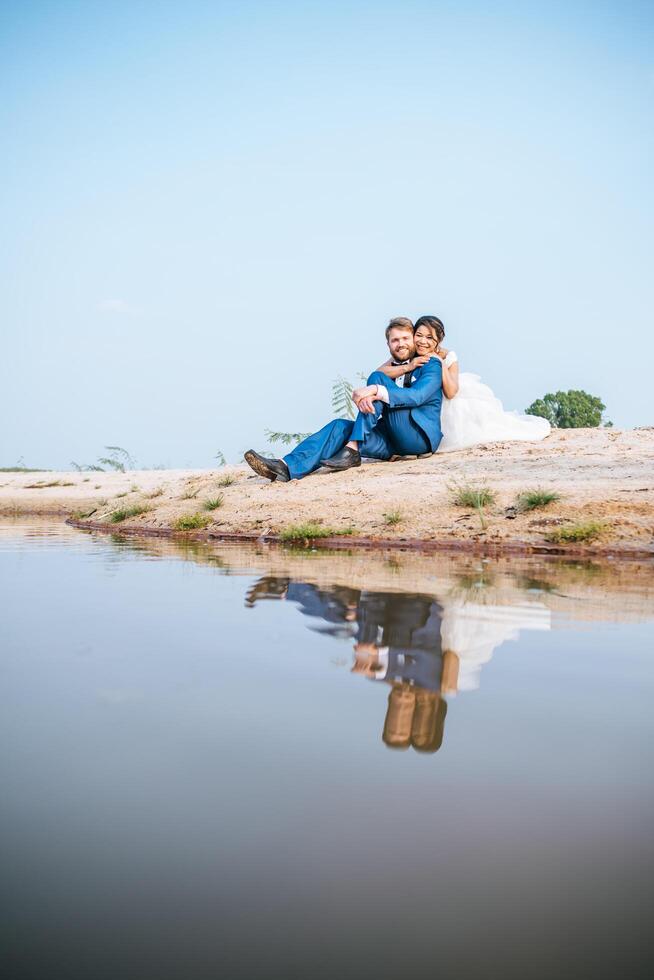 Asian bride and Caucasian groom have romance time and happy together photo