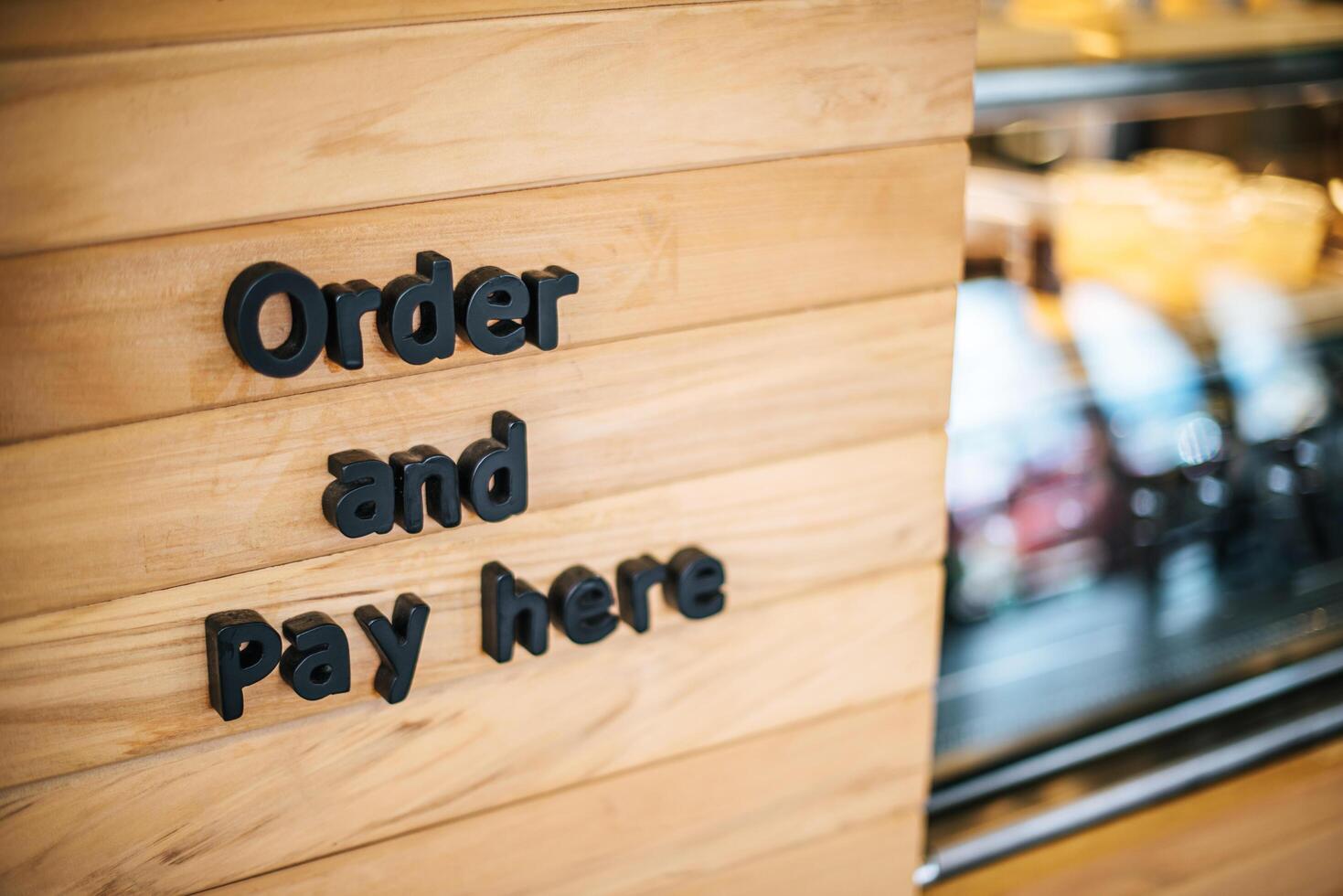 mostrador cafetería cafetería pedir y pagar aquí foto