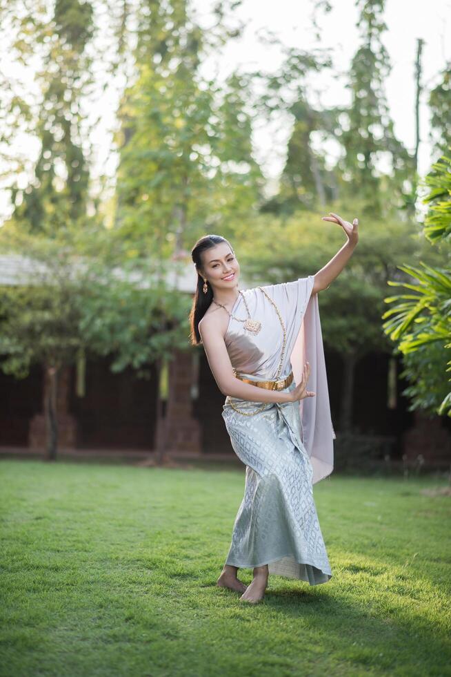 Beautiful Woman wearing typical Thai dress photo